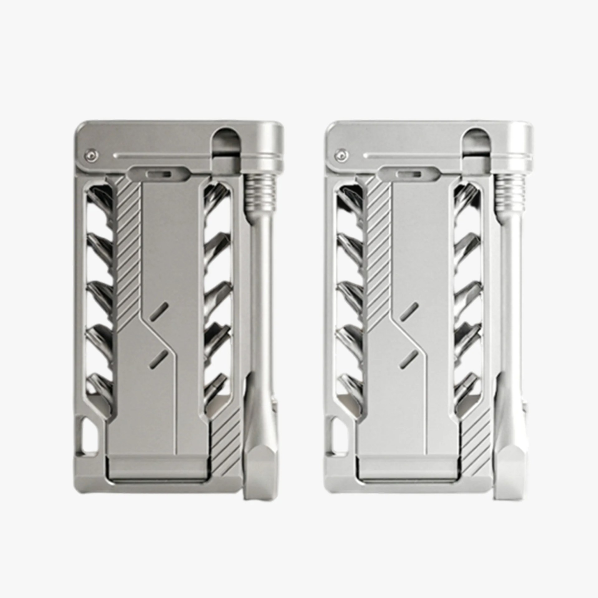 Two silver multi-tool kits with various foldable tools and a compact rectangular design.