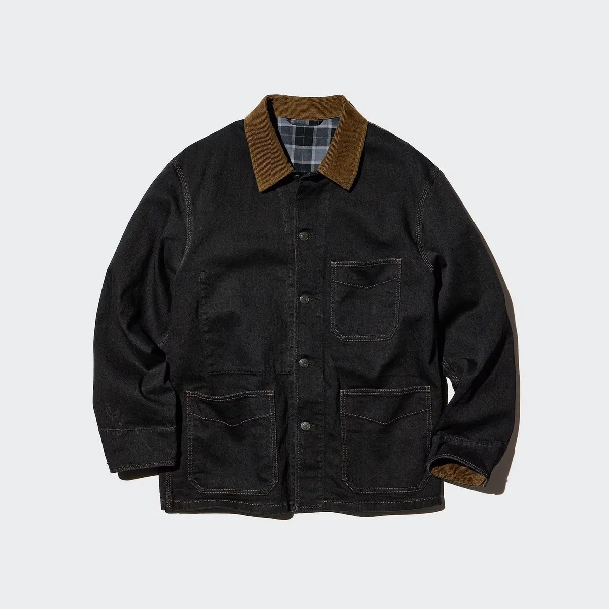 Black denim jacket with brown corduroy collar and three front pockets, shown flat.