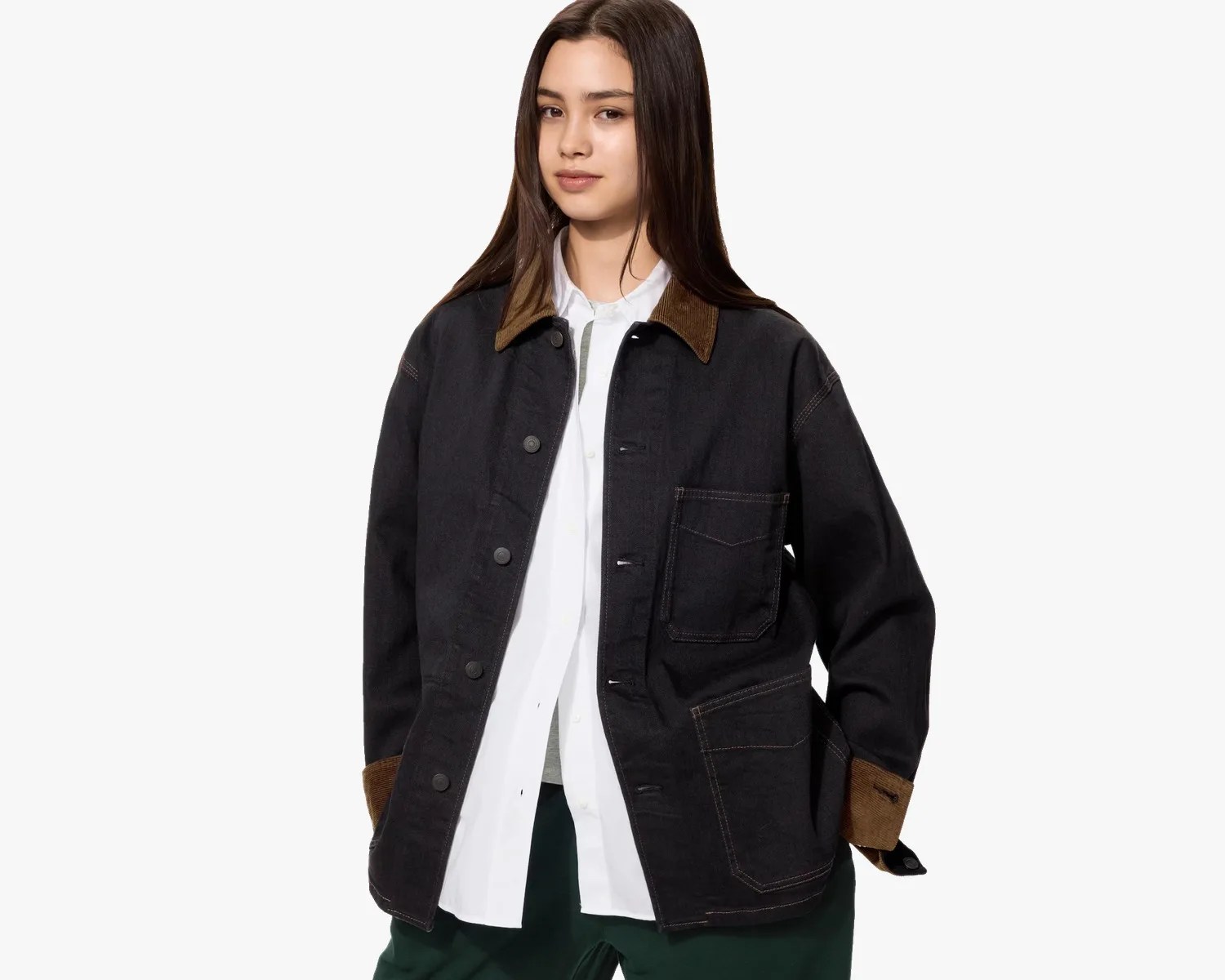 Black denim jacket with brown corduroy collar and cuffs, worn open over a white shirt.