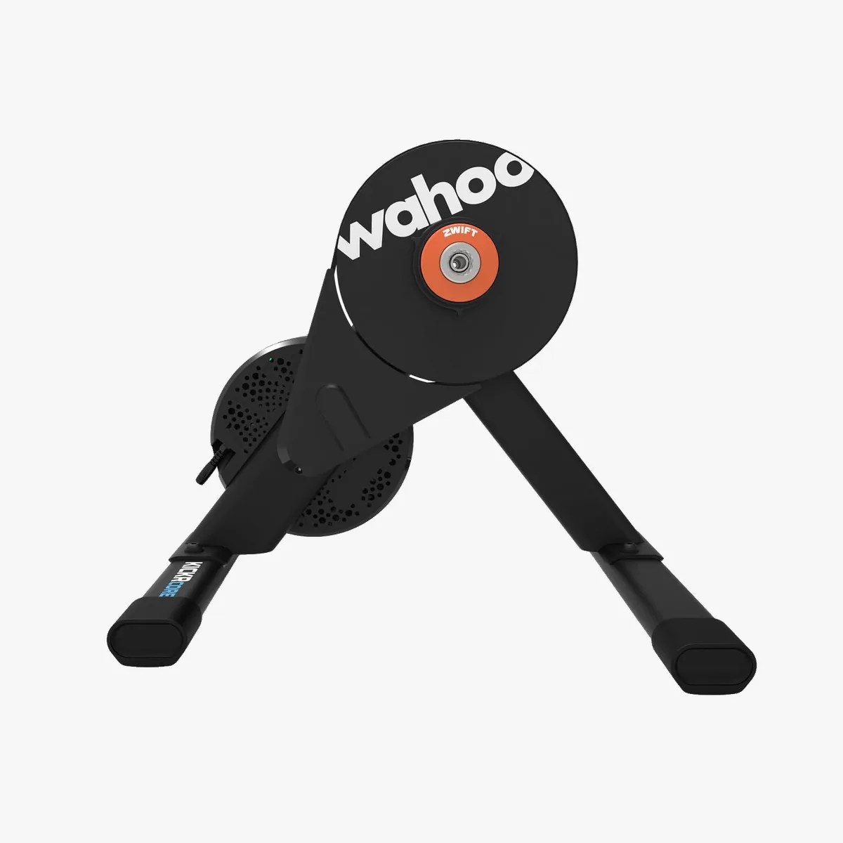 Black Wahoo Kickr Core indoor bike trainer with orange and white branding, shown from the front.