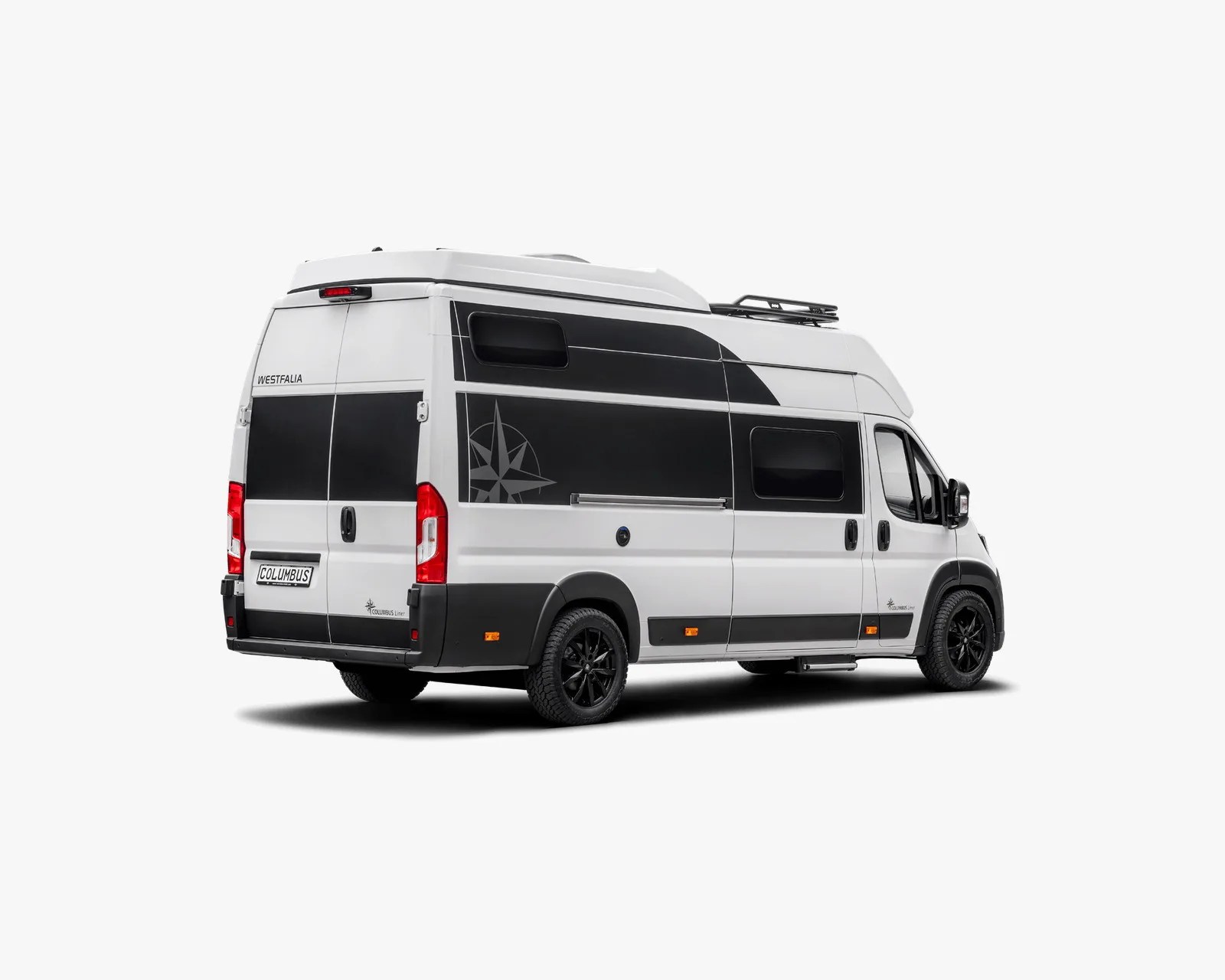 White and black Westfalia Columbus camper van with black wheels and roof rack, shown from rear side.