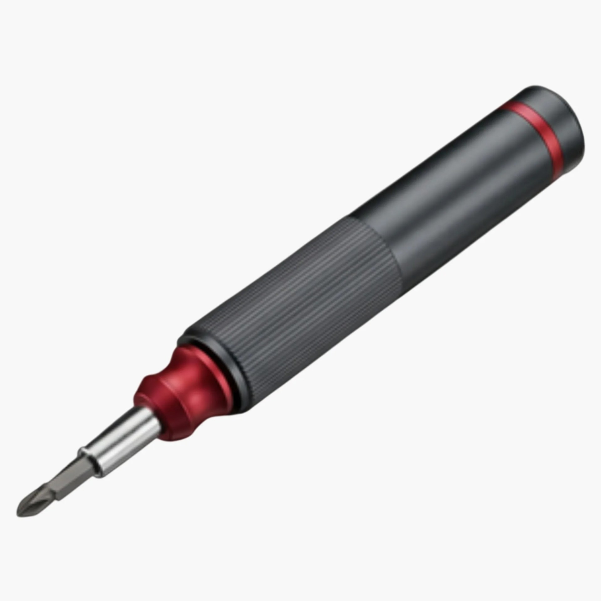 Black and red screwdriver handle with textured grip and metal shaft with Phillips head bit.