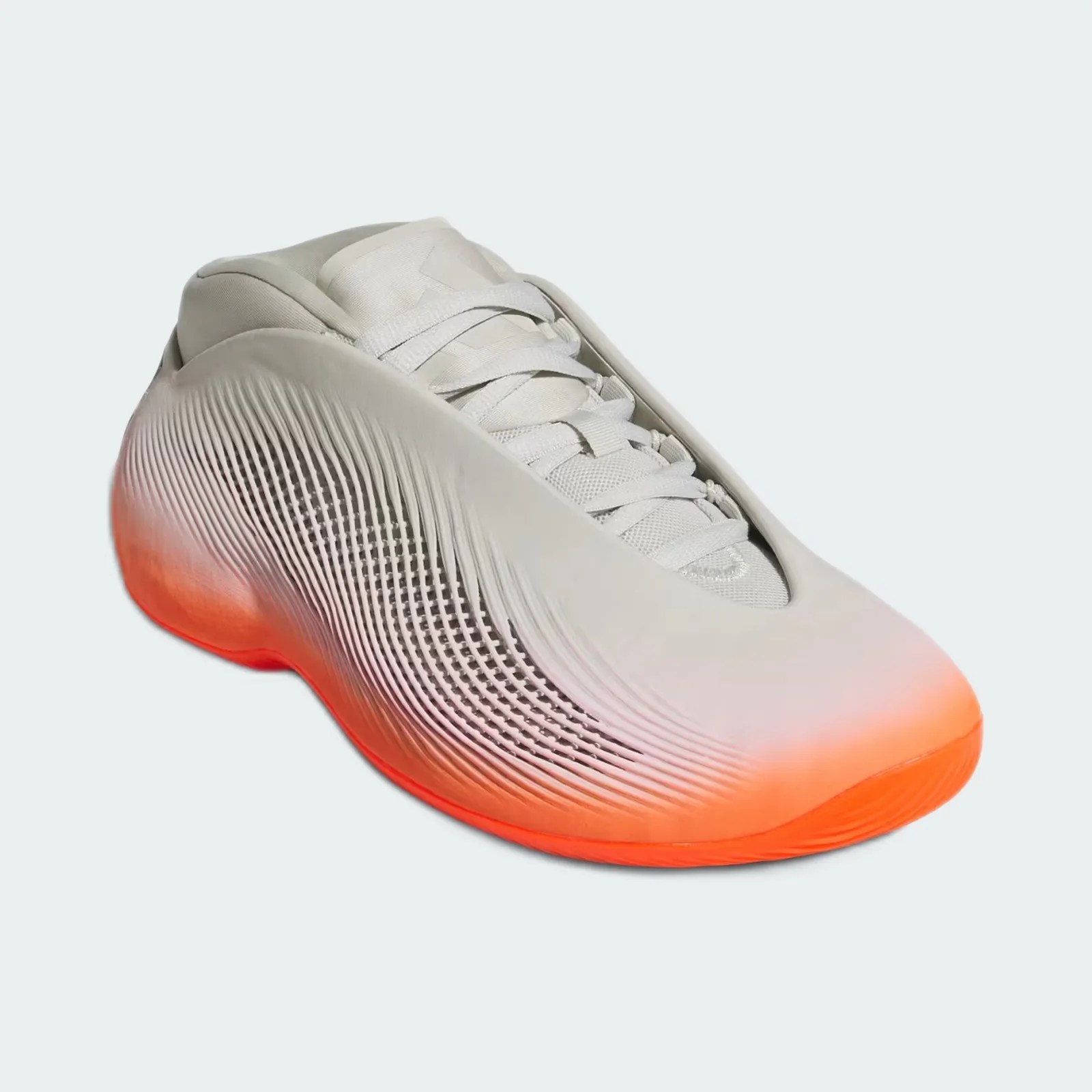 Light gray sneaker with textured side panels and bright orange gradient sole.