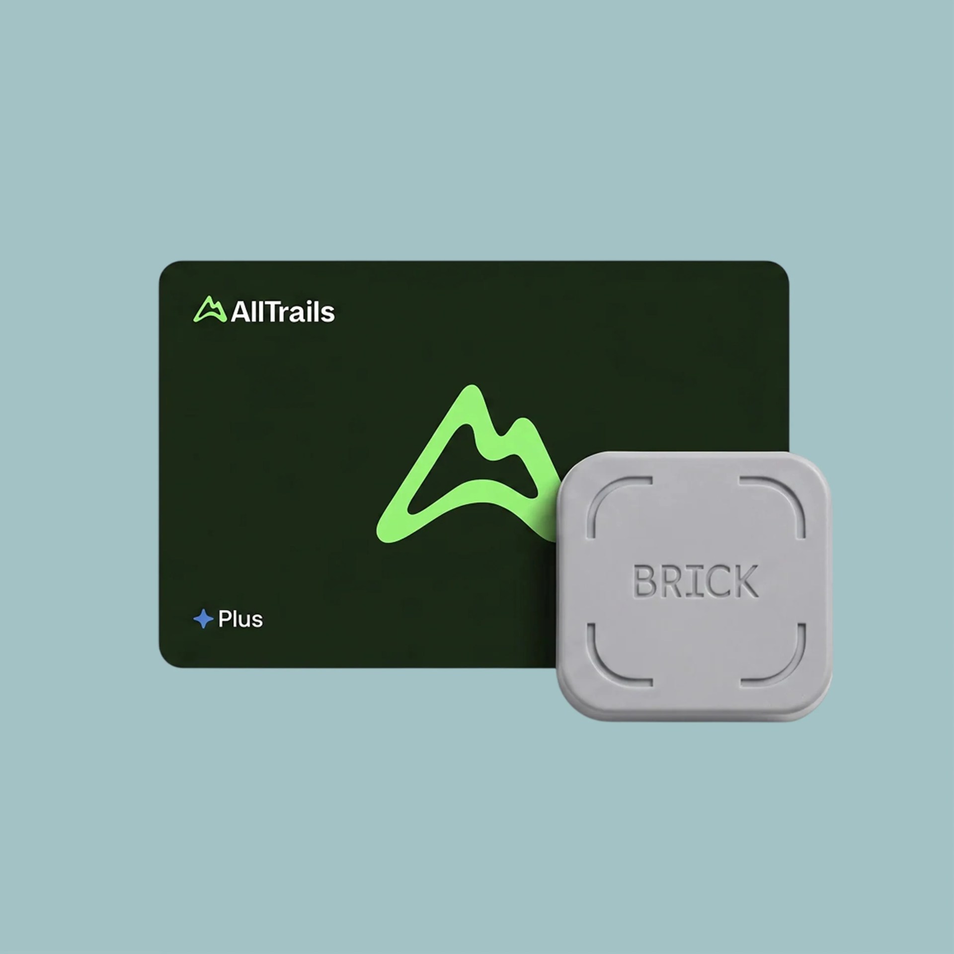 Green AllTrails Plus card partially covered by a gray BRICK GPS tracker on a light blue background.
