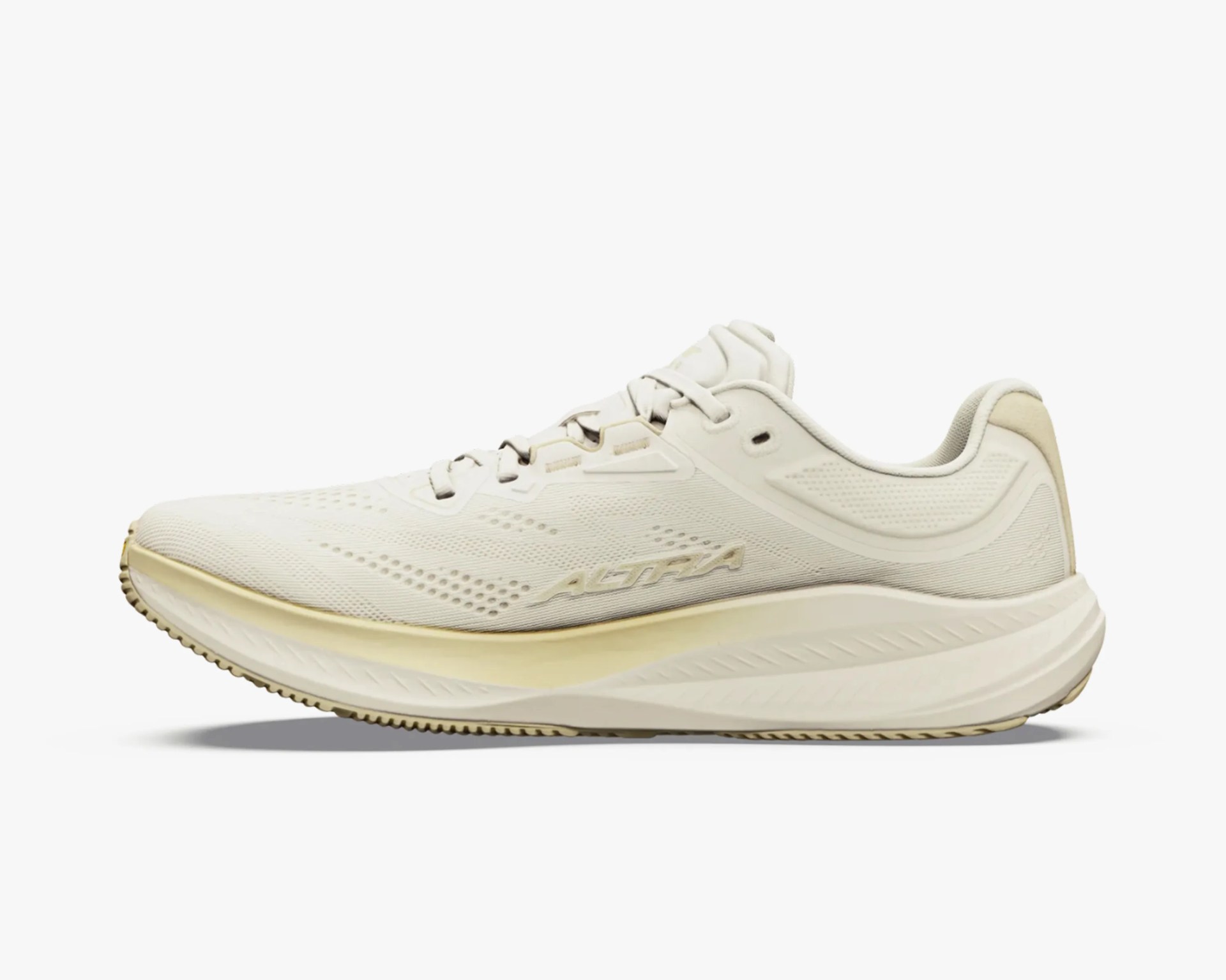 Off-white Altra running shoe with mesh upper and cushioned sole shown from the side.
