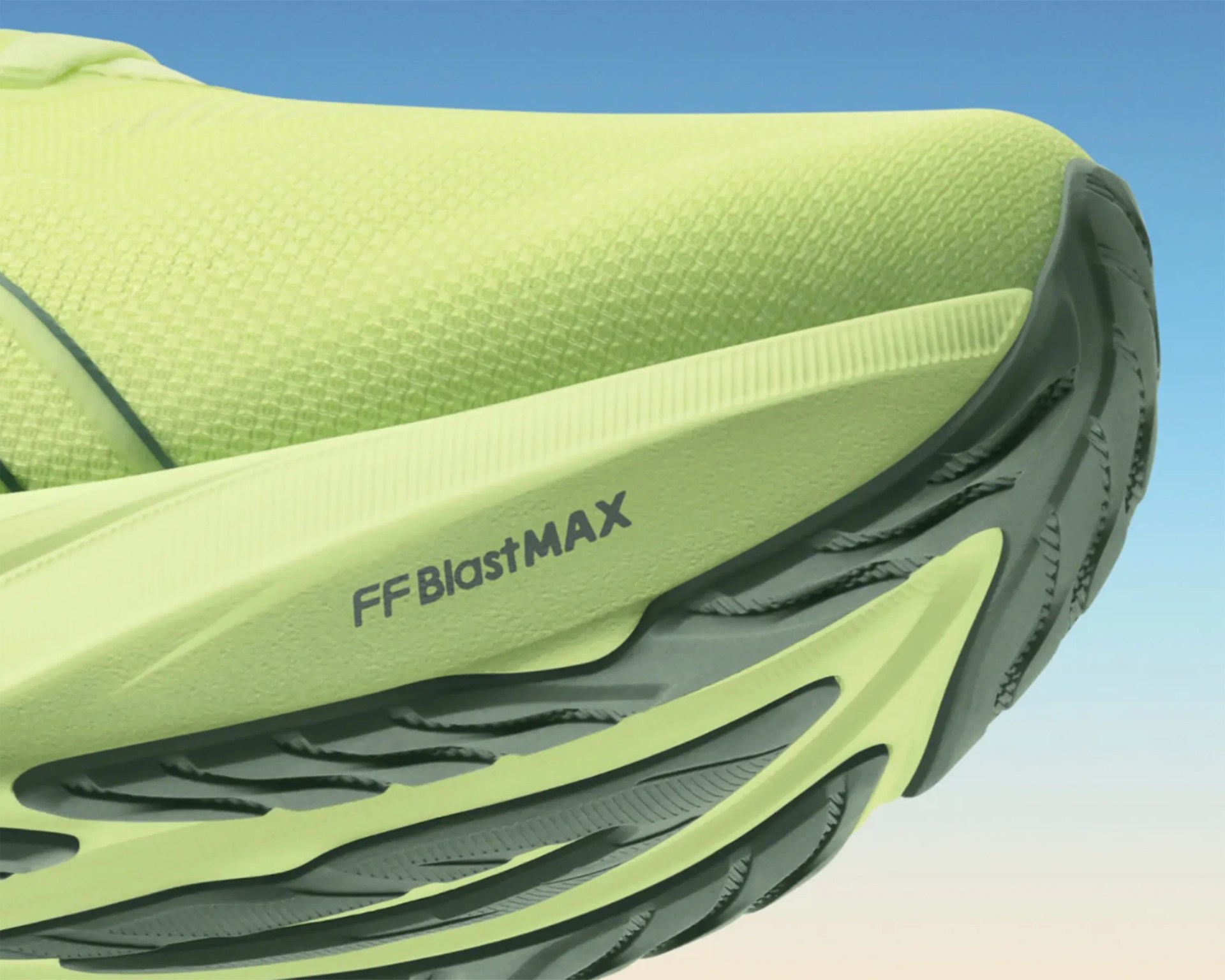 Close-up of a light green running shoe sole with "FF BlastMAX" text and black tread pattern.