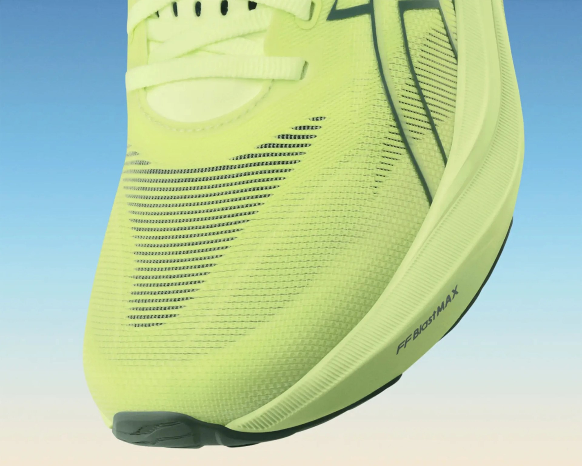 Close-up of a neon yellow running shoe with black accents and "FF BIOSTMAX" text on the sole.