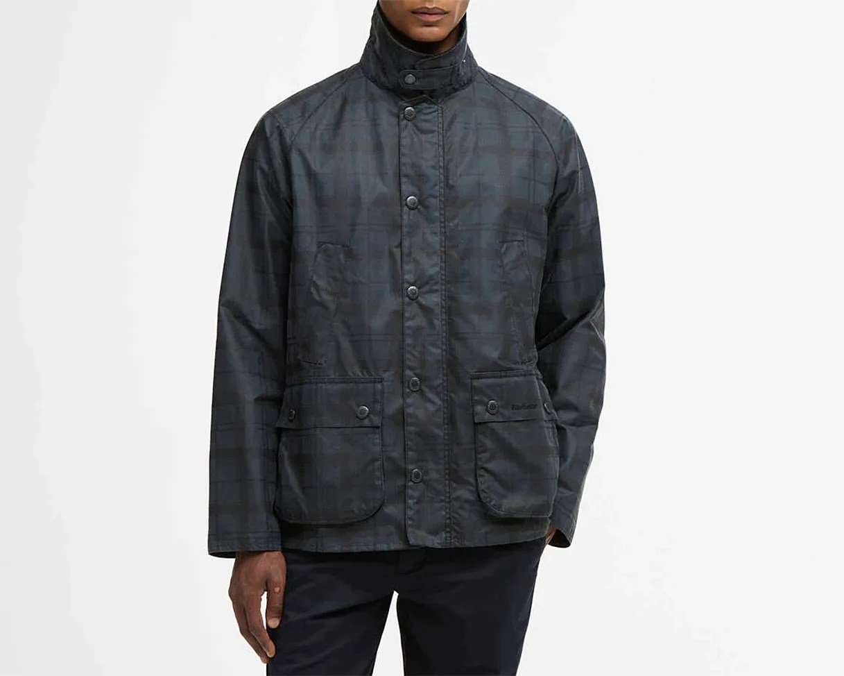 Dark blue and black checkered jacket with snap button front and four front pockets worn by a person.