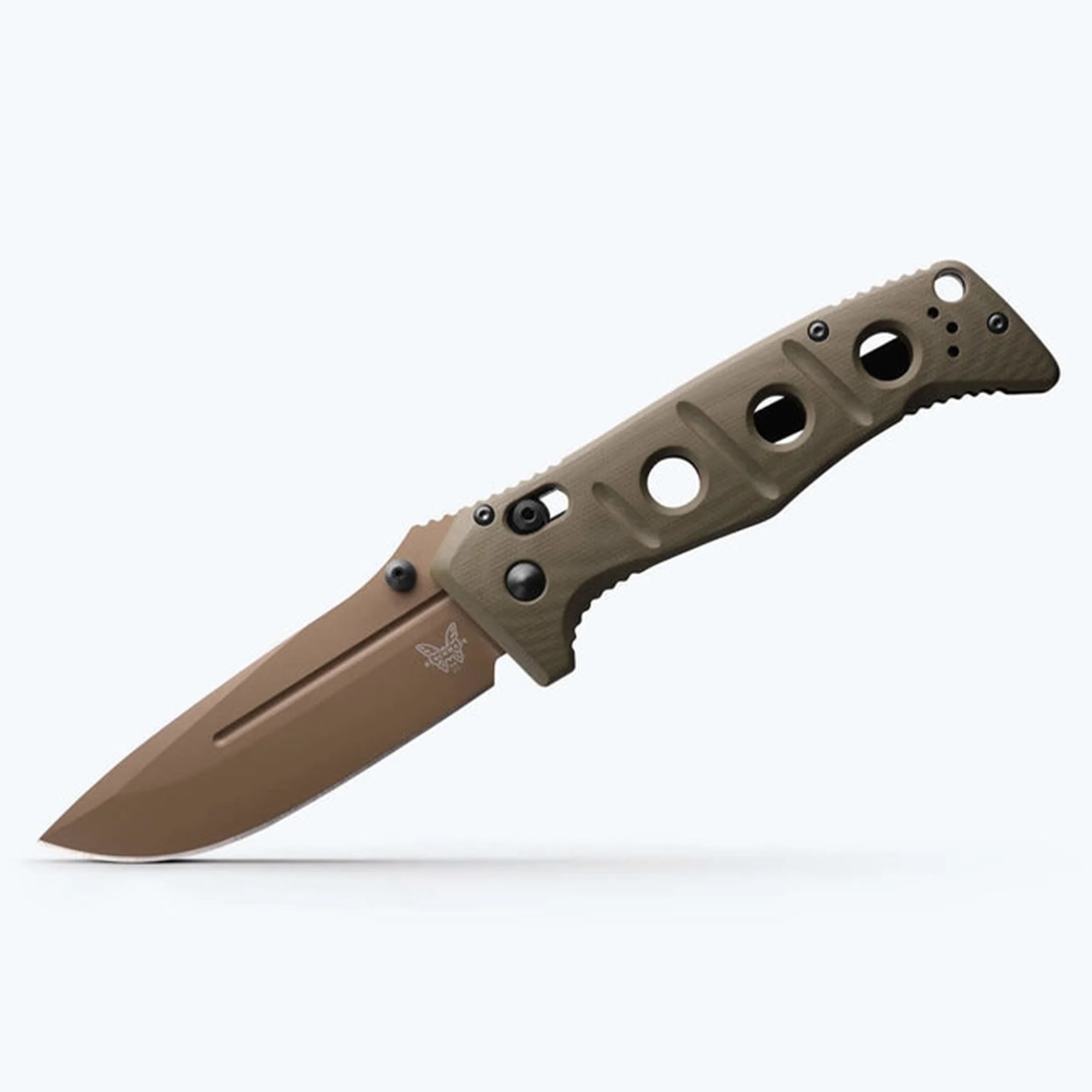 Tan folding knife with textured handle featuring circular cutouts and butterfly logo on blade.
