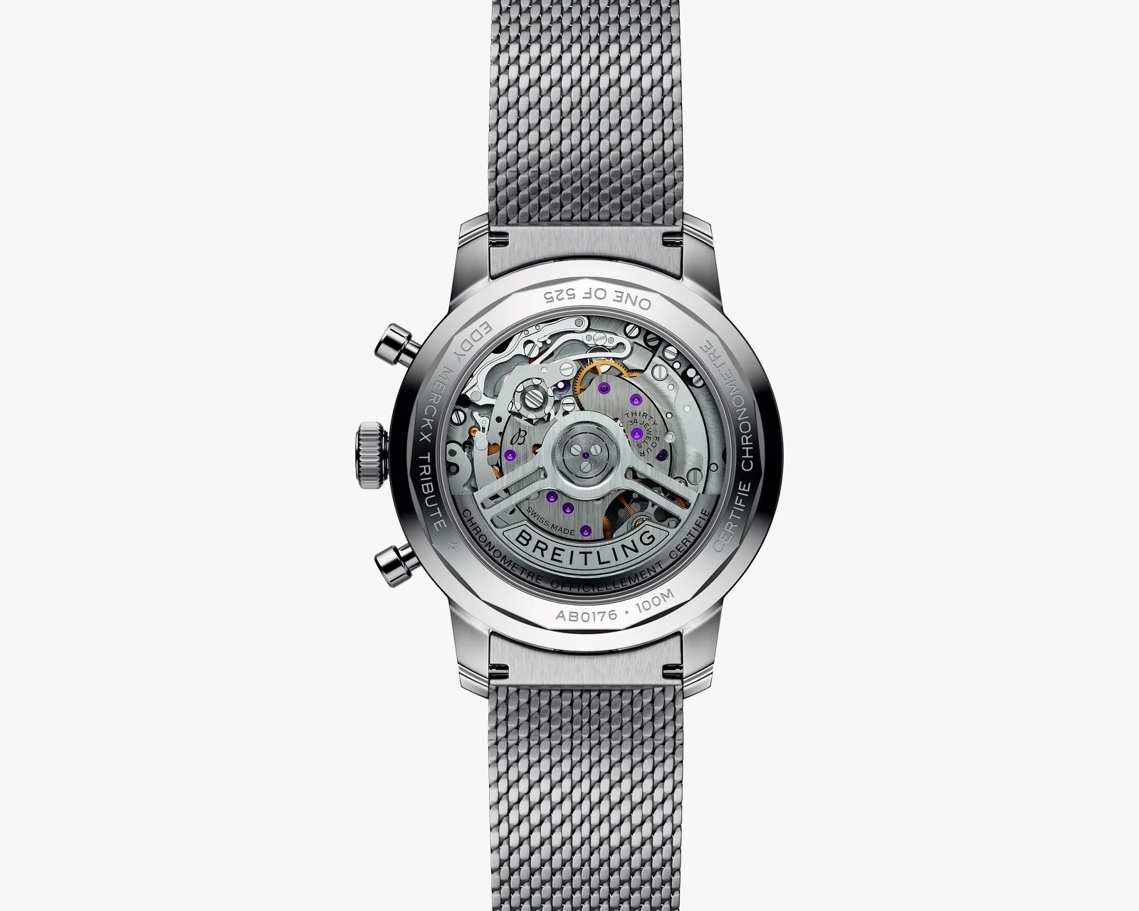 Back view of a Breitling watch with a stainless steel mesh strap and visible mechanical movement inside the case.