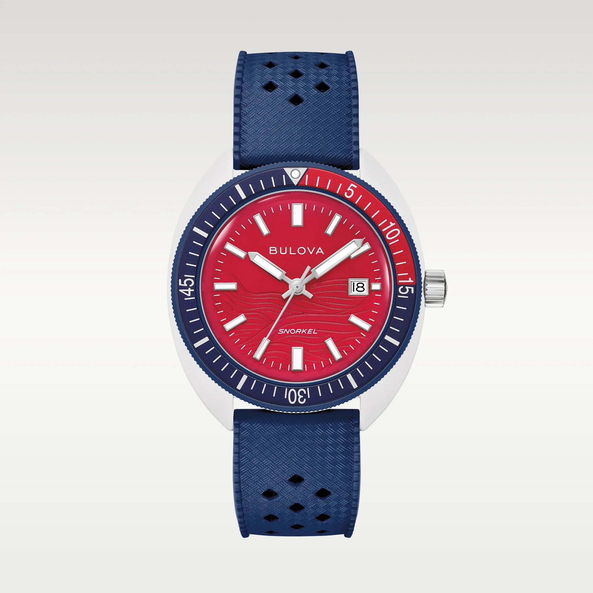 Blue textured perforated rubber watch strap attached to a silver case with a red and blue bezel.