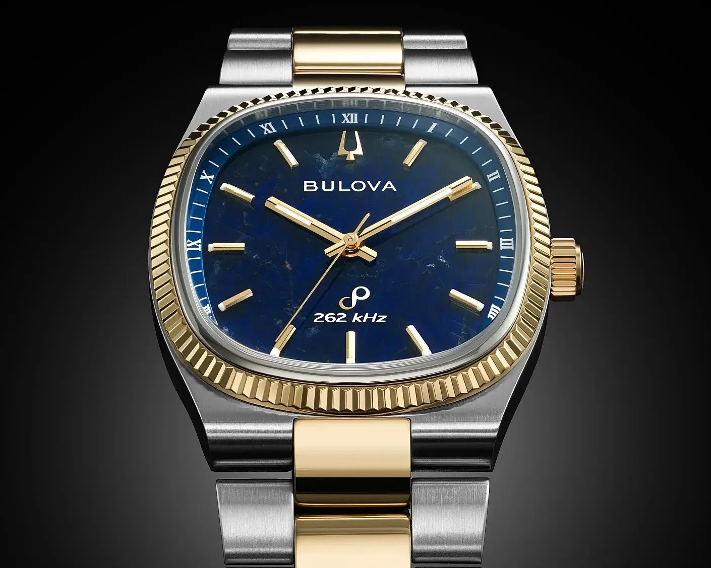 Two-tone Bulova wristwatch with a blue dial, gold accents, and a stainless steel and gold bracelet.