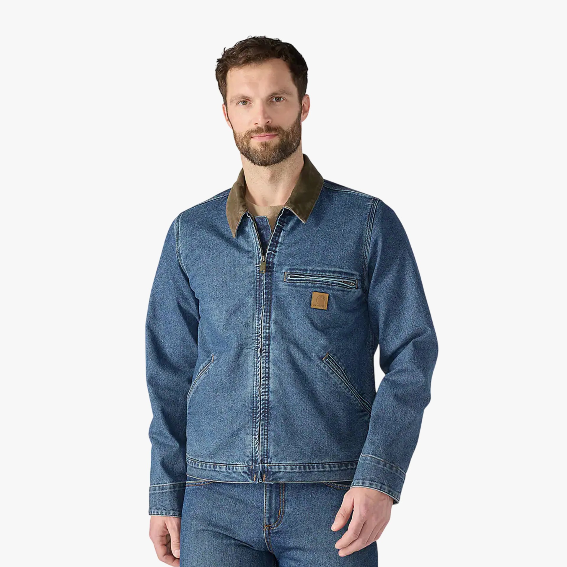 Blue denim jacket with brown corduroy collar and zippered chest pocket worn by a person.