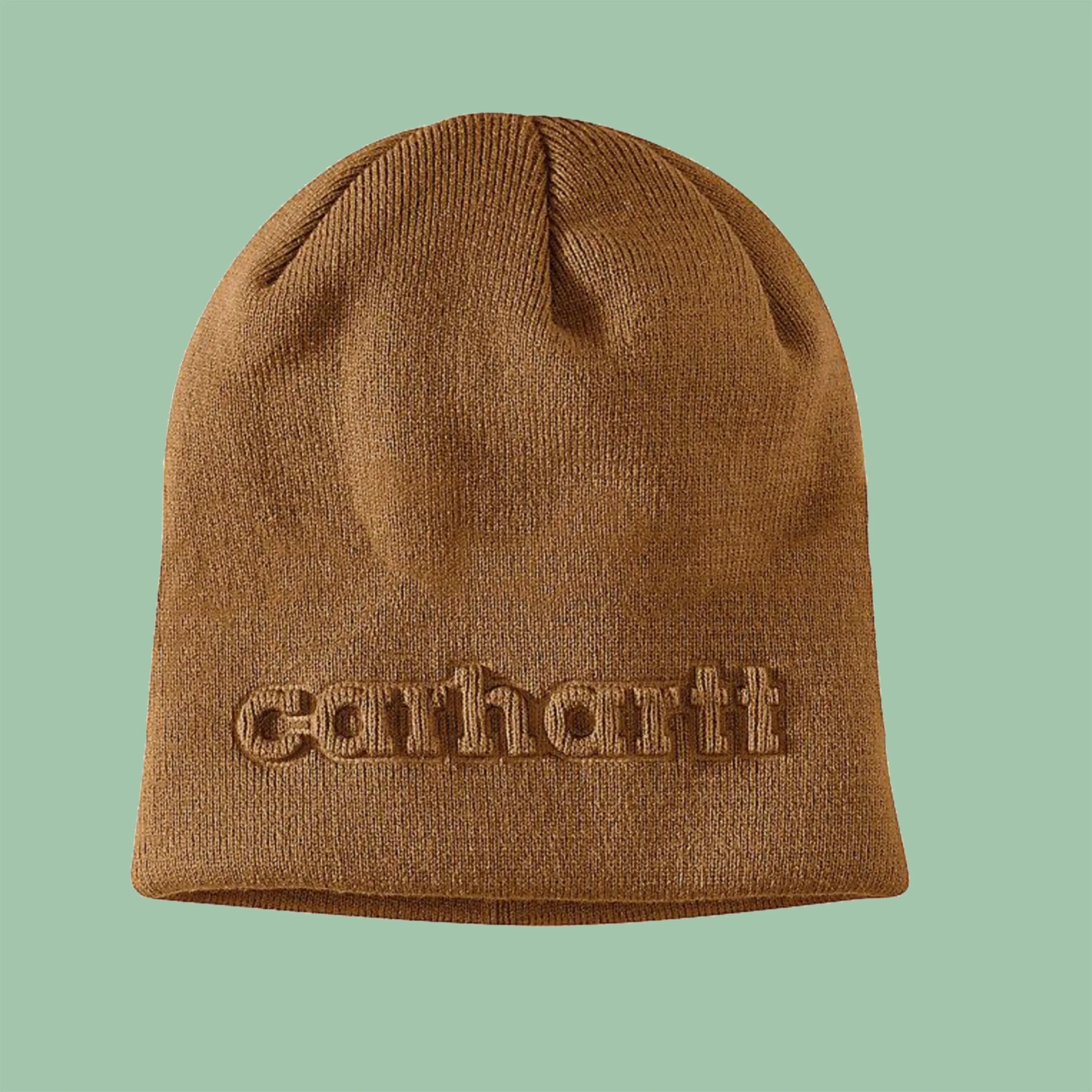 Brown knit beanie with "Carhartt" embroidered on the front against a green background.