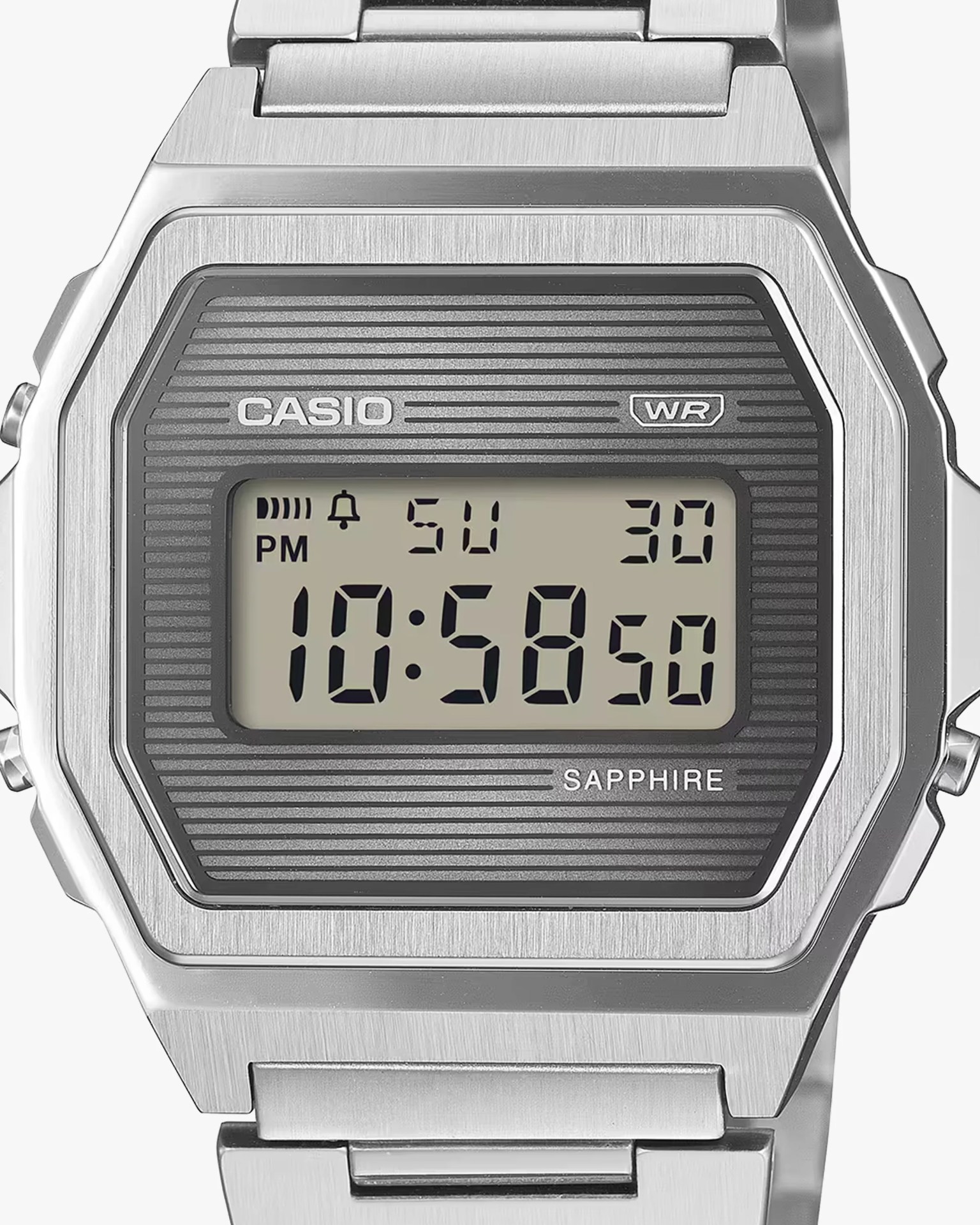 Close-up of a Casio digital watch with a silver metal case and bracelet, displaying time 10:58:50 and date Su 30.