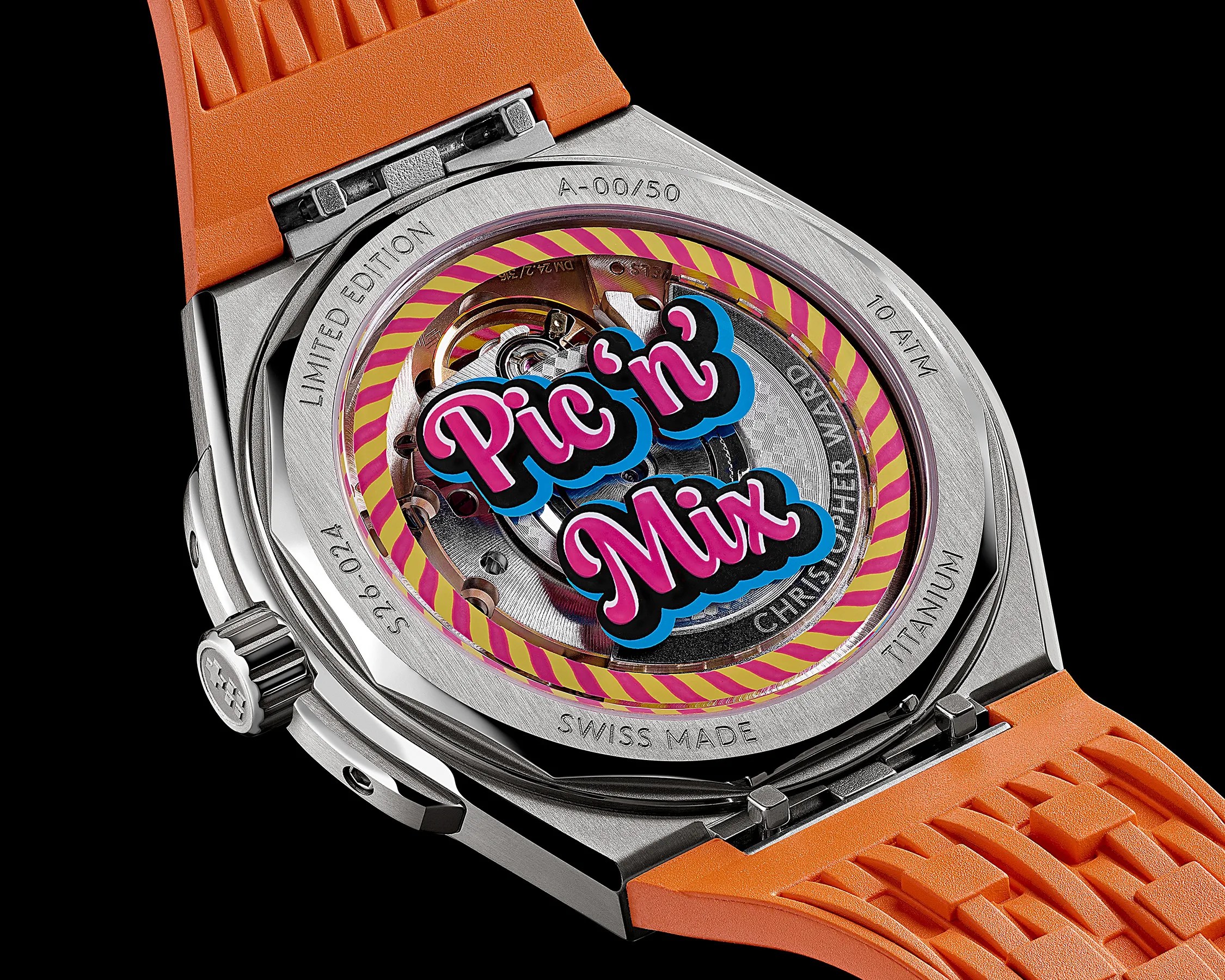Close-up of a titanium watch back with orange strap, showing "Pic'n Mix" graphic and "Limited Edition" engraving.
