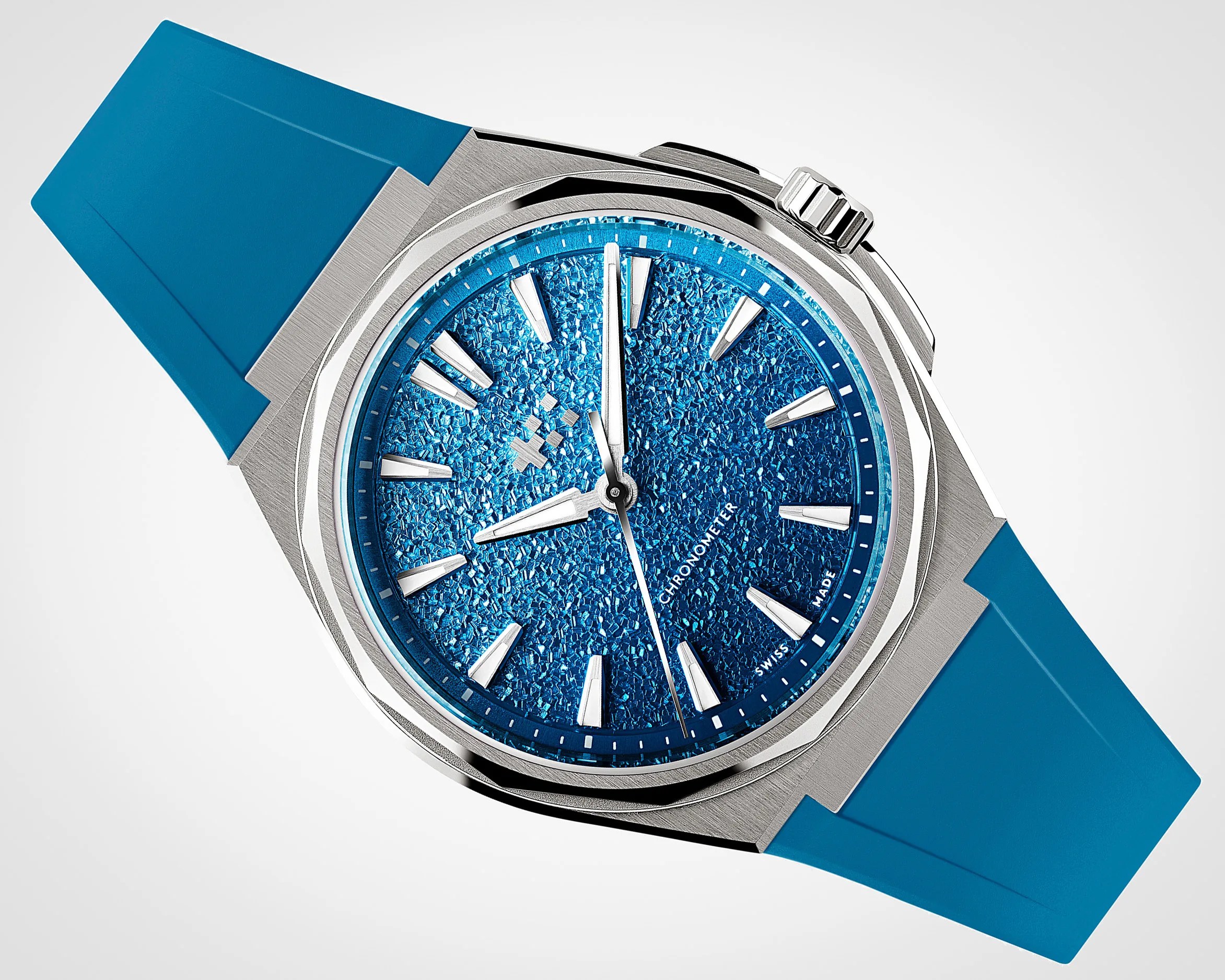 Silver metal wristwatch with textured blue dial and blue rubber strap.