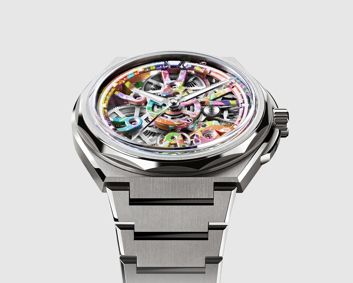 Silver metal wristwatch with a colorful, skeletonized dial showing internal gears and mechanisms.