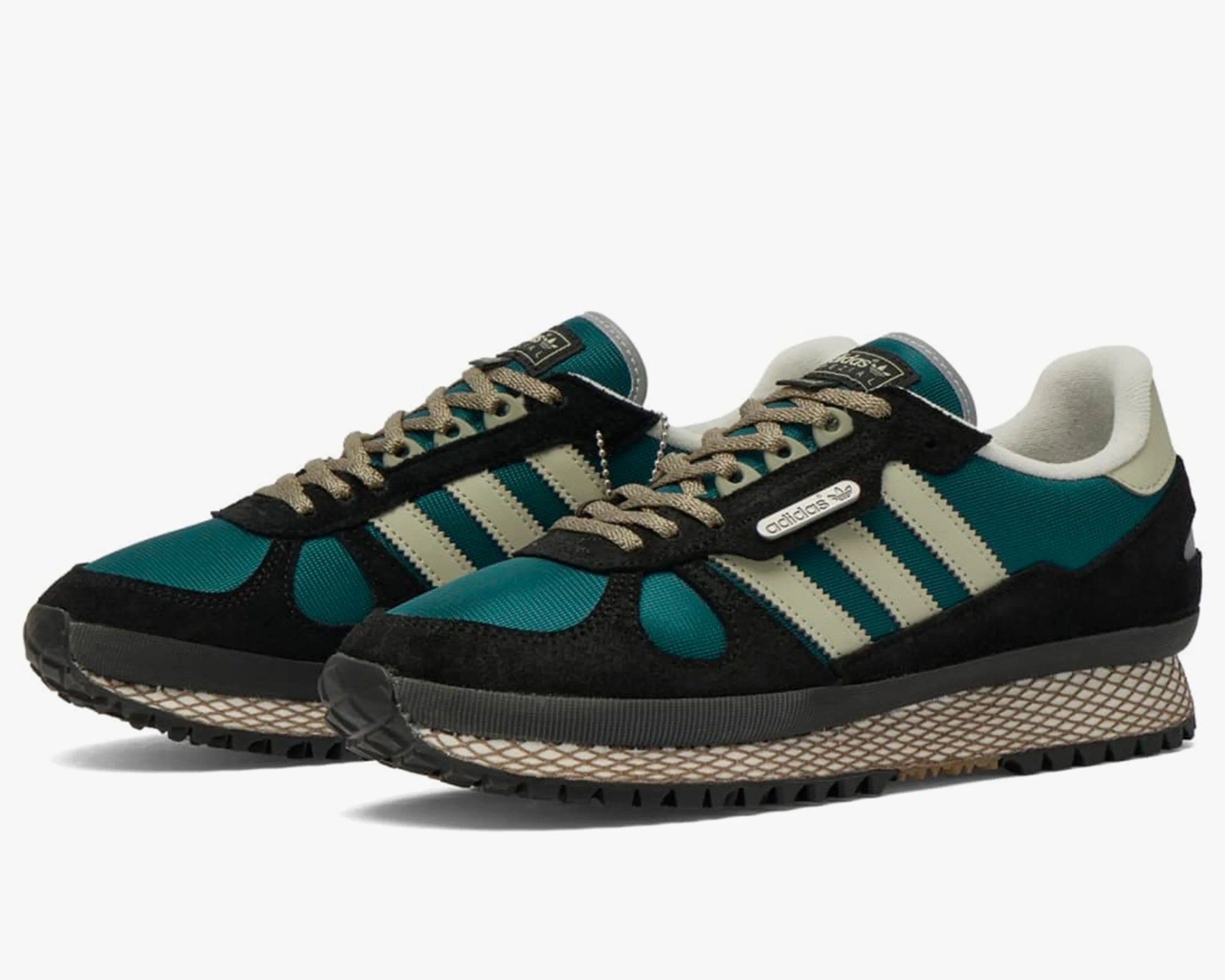Pair of teal and black Adidas sneakers with beige stripes and textured beige midsoles.