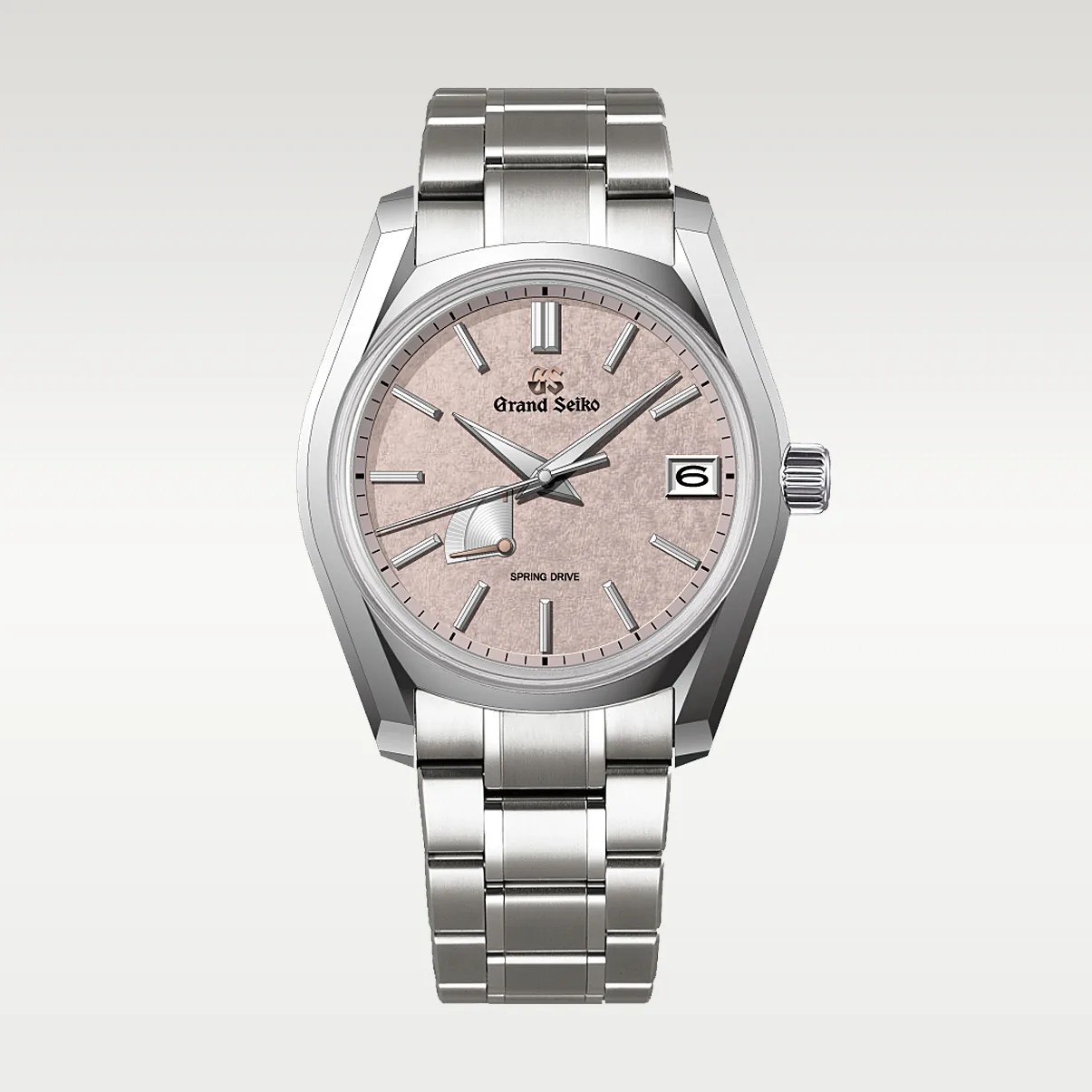Silver stainless steel Grand Seiko wristwatch with textured light pink dial and date window at 3 o'clock.