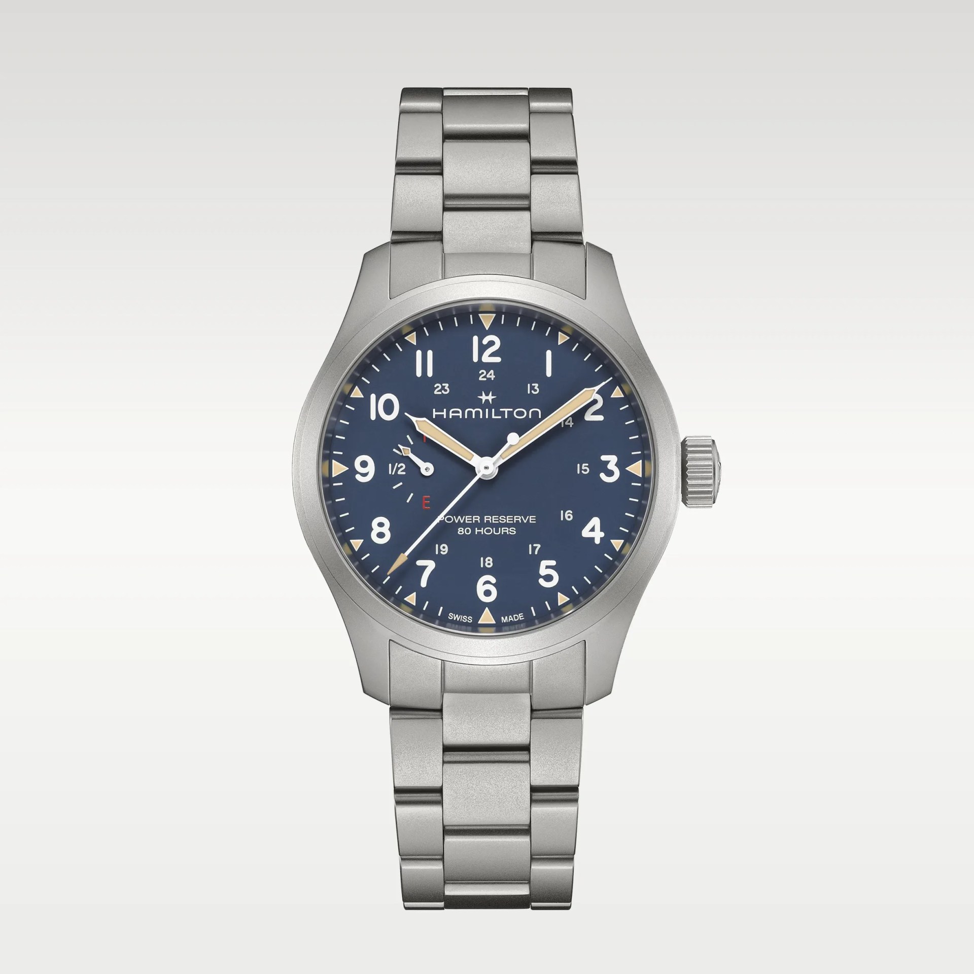 Silver metal bracelet watch with blue dial, white numerals, and beige hands showing "Hamilton" brand.