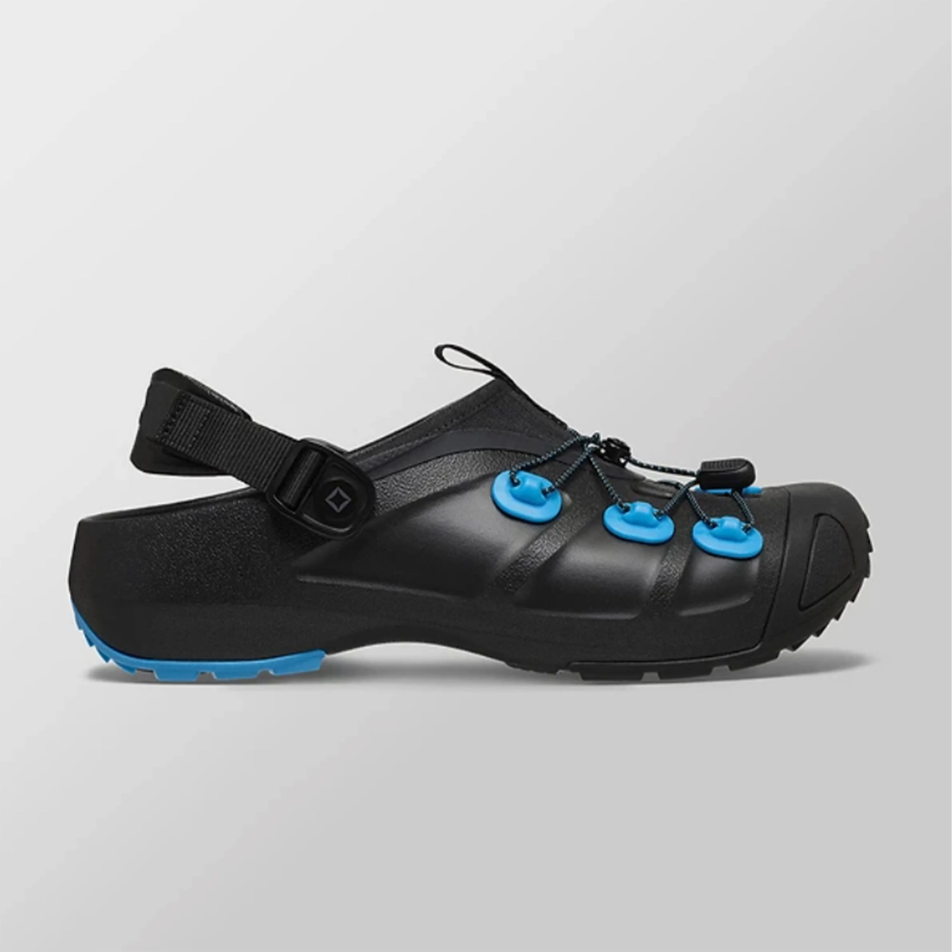 Black and blue outdoor sandal with adjustable strap and bungee cord lacing system.