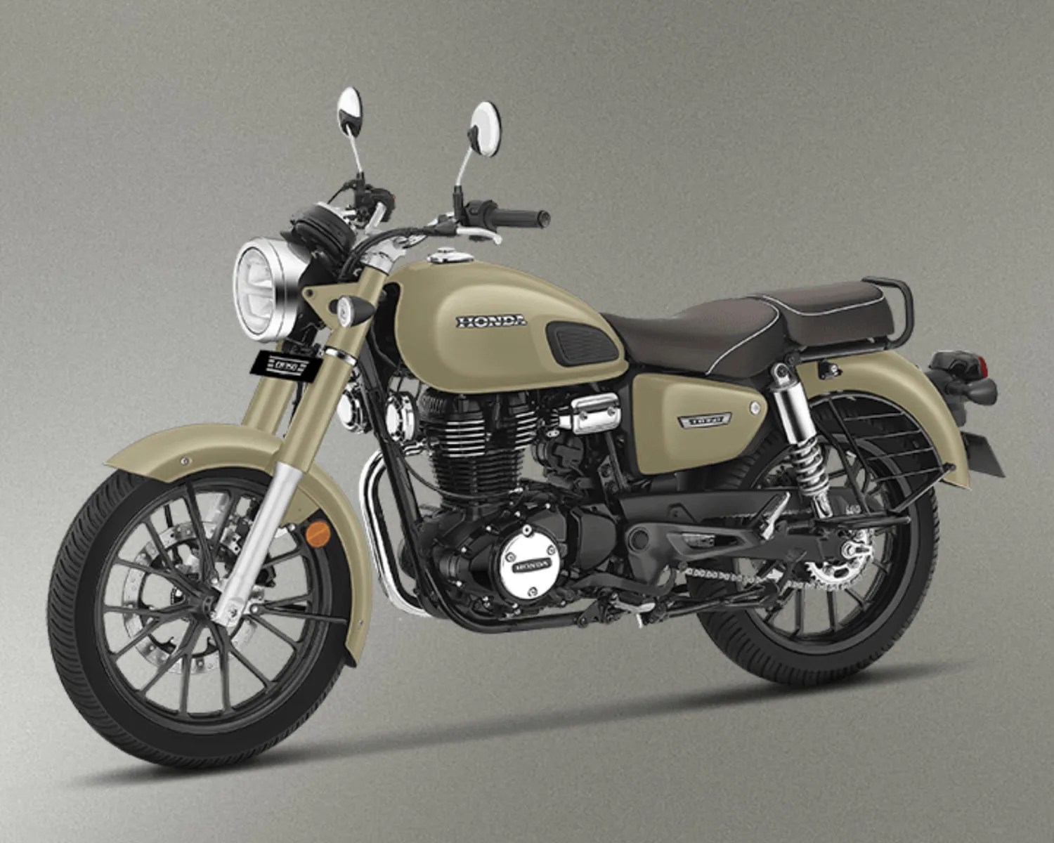 Beige Honda motorcycle with black and chrome engine components and a brown seat against a gray background.