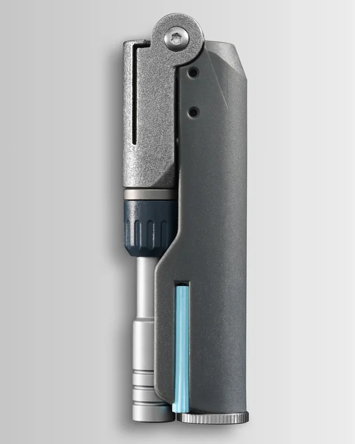 Close-up of a metallic gray and blue multi-tool with a textured grip and a small blue component on a light gray background.
