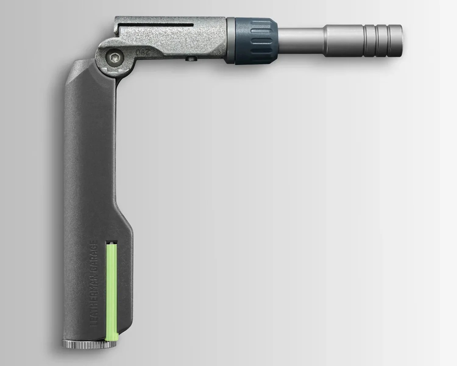 Gray and silver foldable torch lighter with a green ignition strip on a white background.