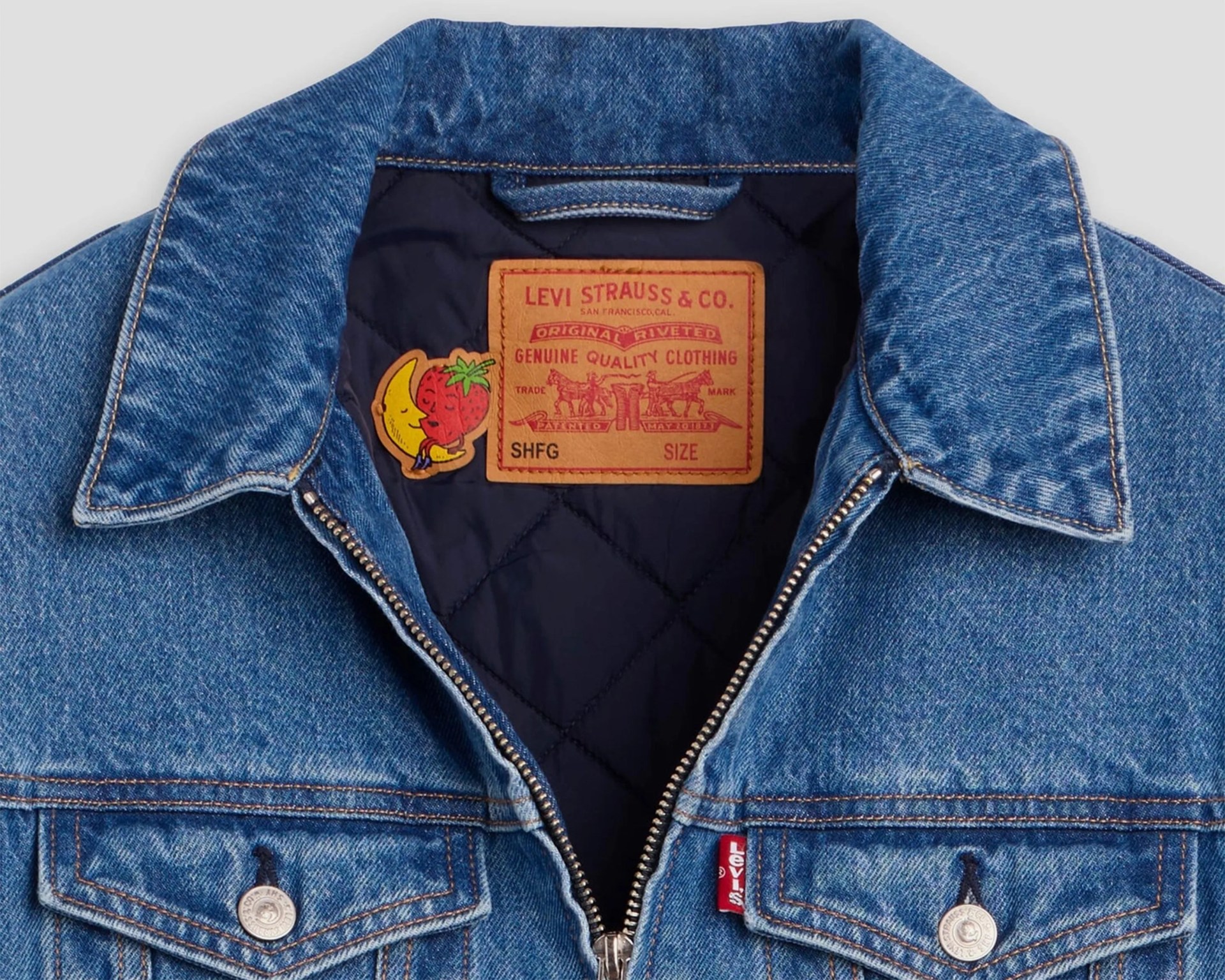 Blue denim Levi's jacket with quilted black lining and a leather Levi Strauss & Co. label inside the collar.