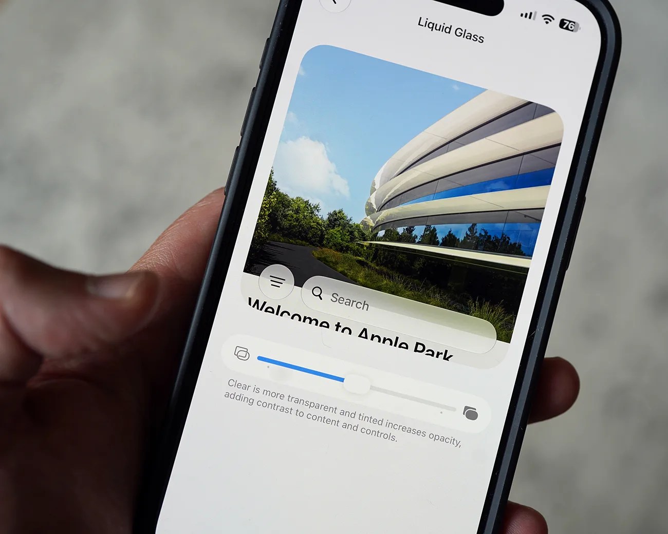 Smartphone screen showing a "Liquid Glass" app with a photo of Apple Park and a transparency slider.