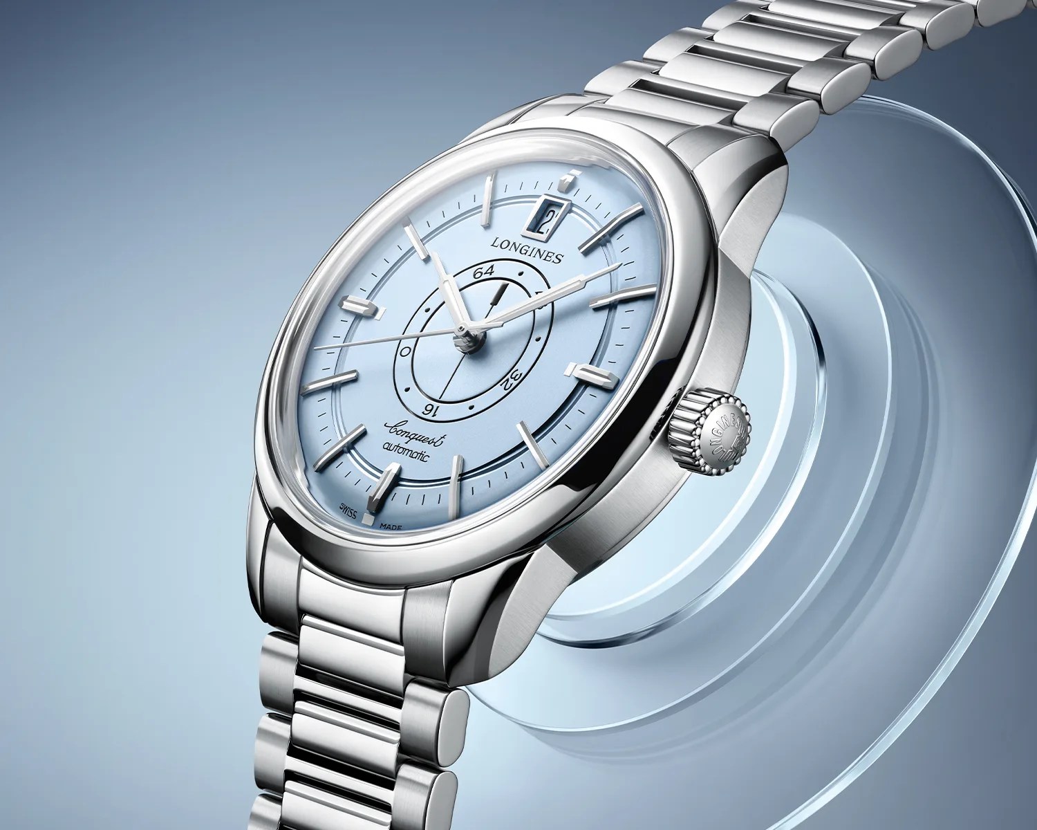 Silver Longines Conquest automatic wristwatch with light blue dial and date window at 12 o'clock.