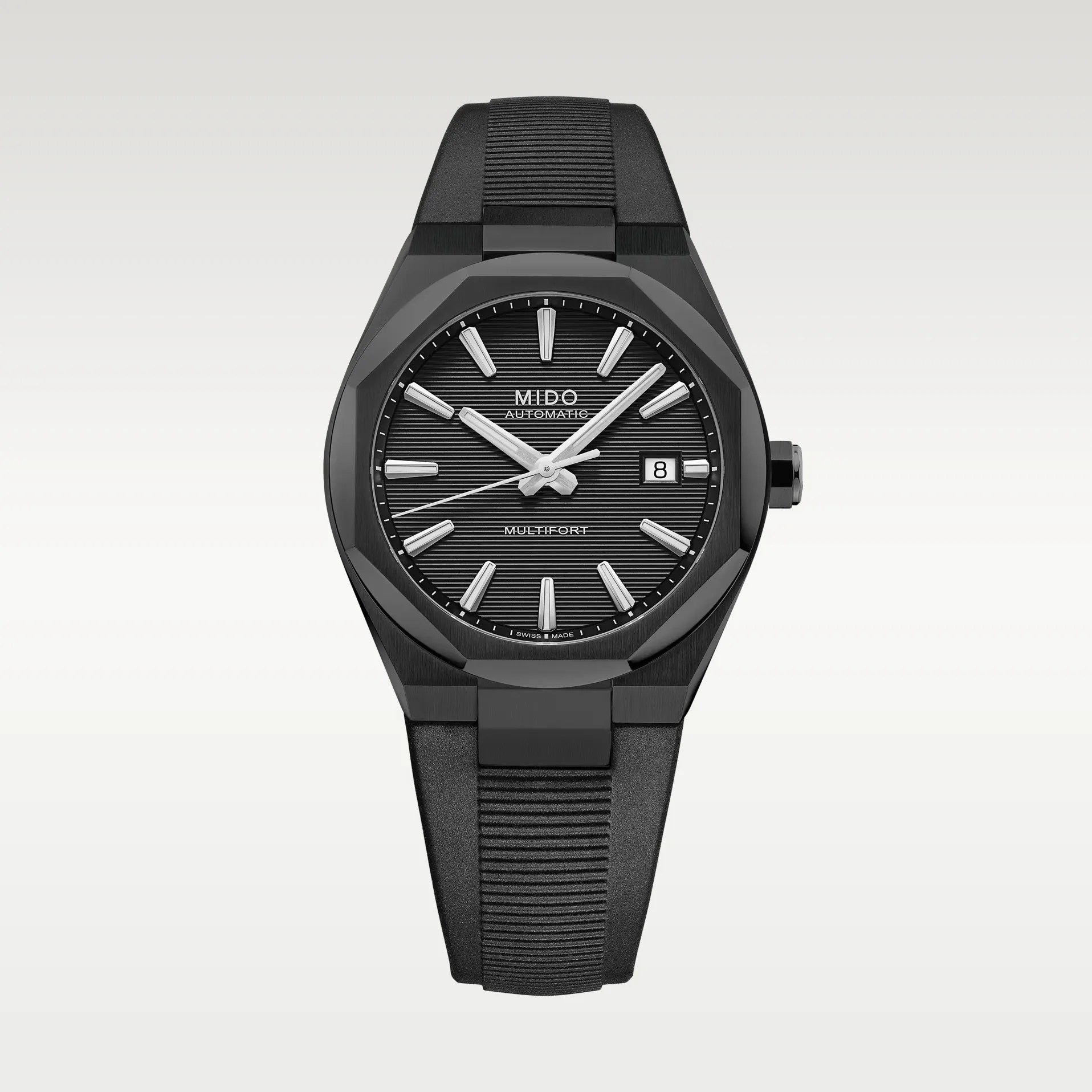 Black Mido Multifort automatic watch with textured dial, silver hour markers, date window, and black rubber strap.