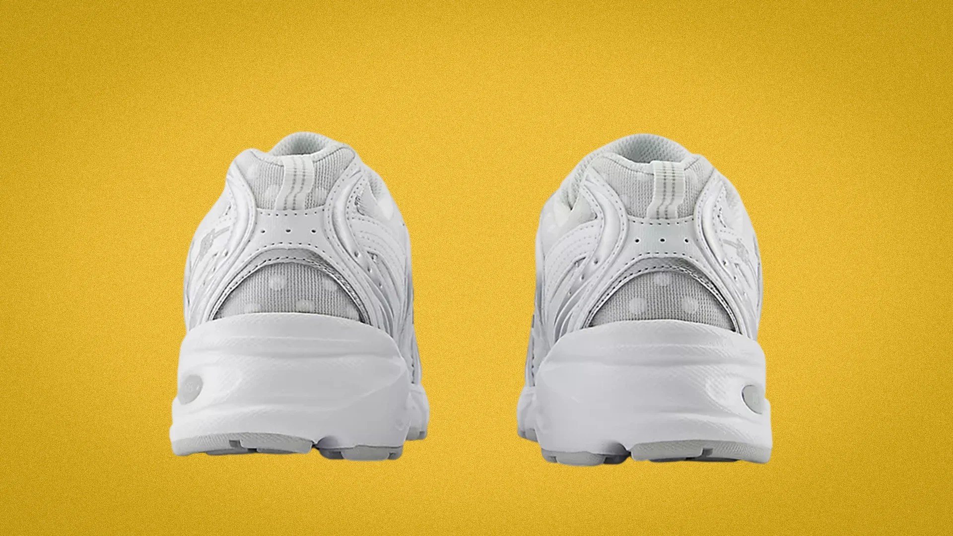 Pair of white athletic sneakers shown from the back on a yellow background.
