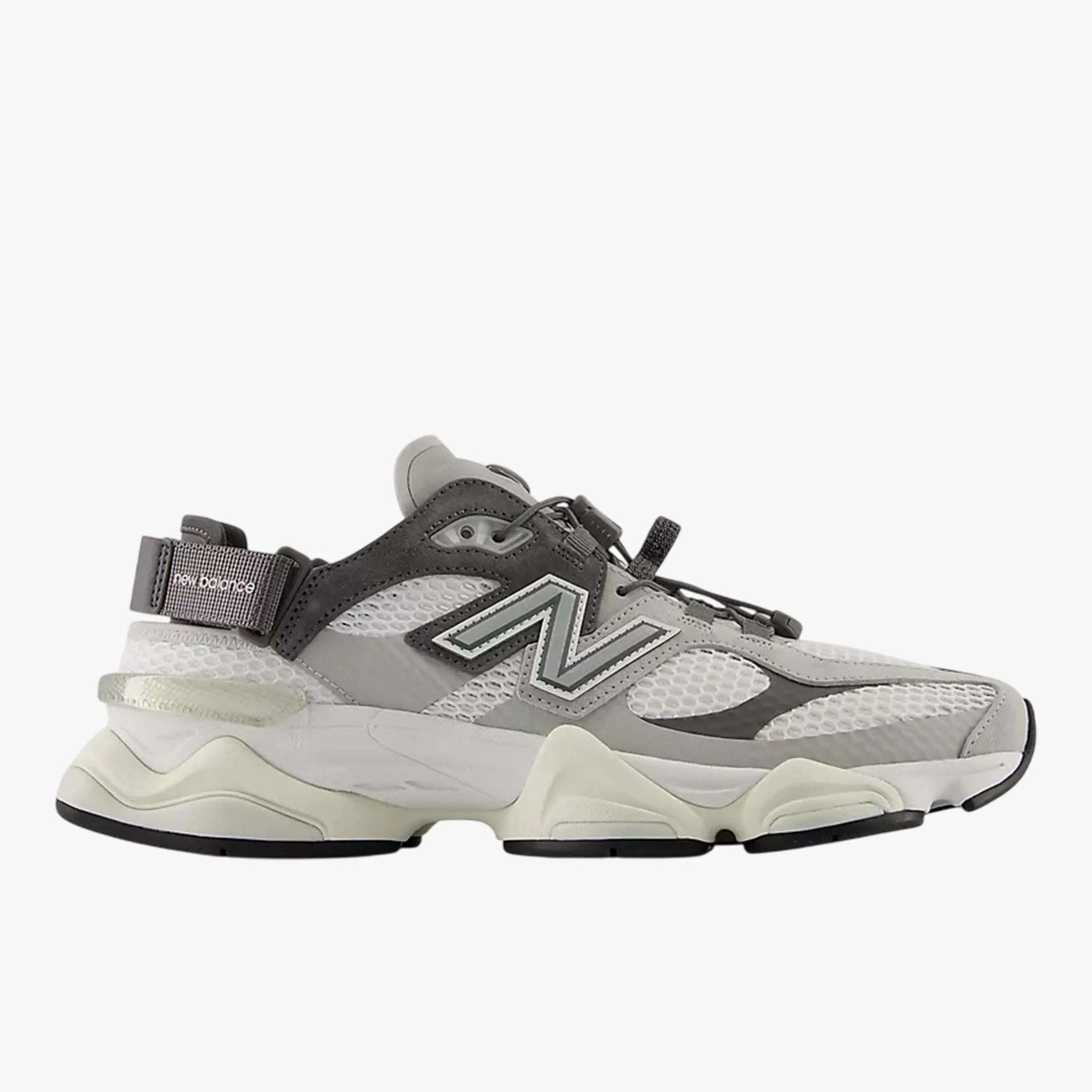 Gray and black New Balance sneaker with mesh panels and chunky white sole.