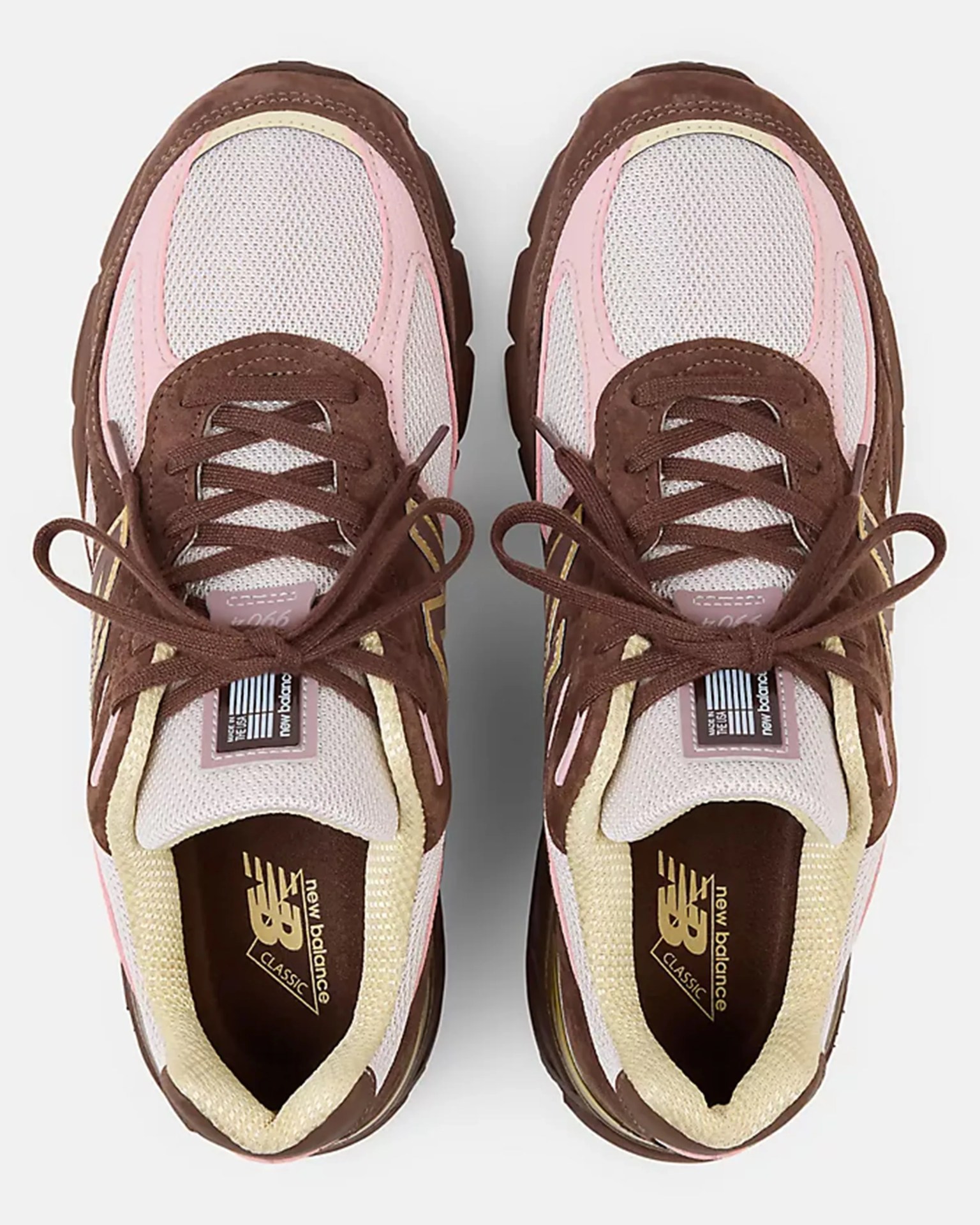 Pair of New Balance Classic sneakers in brown, pink, and cream with mesh and suede uppers, viewed from above.