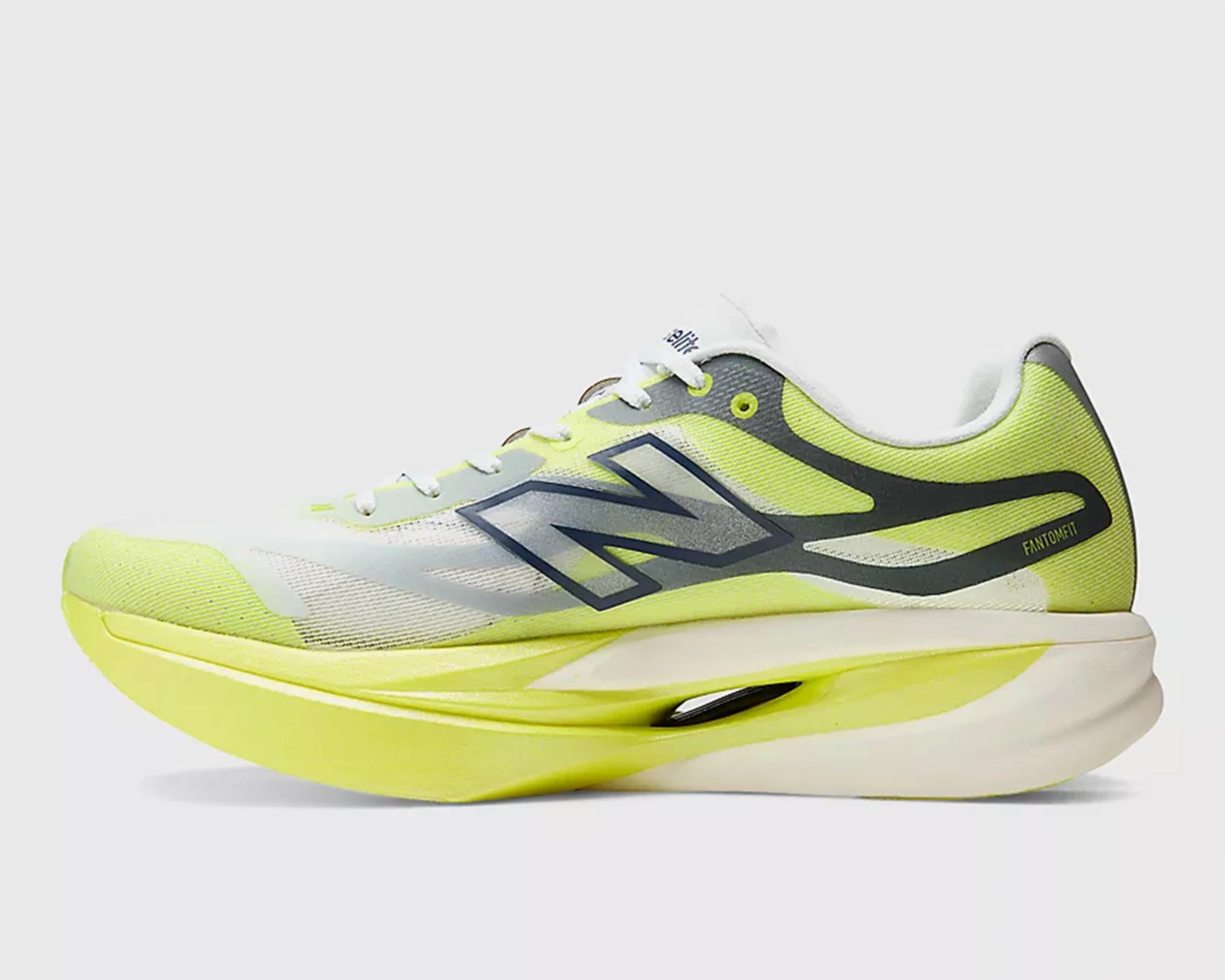 Yellow and white New Balance running shoe with black logo and cushioned sole.