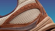 Close-up of a brown suede and beige mesh Nike Air Max sneaker with visible stitching and textured sole.