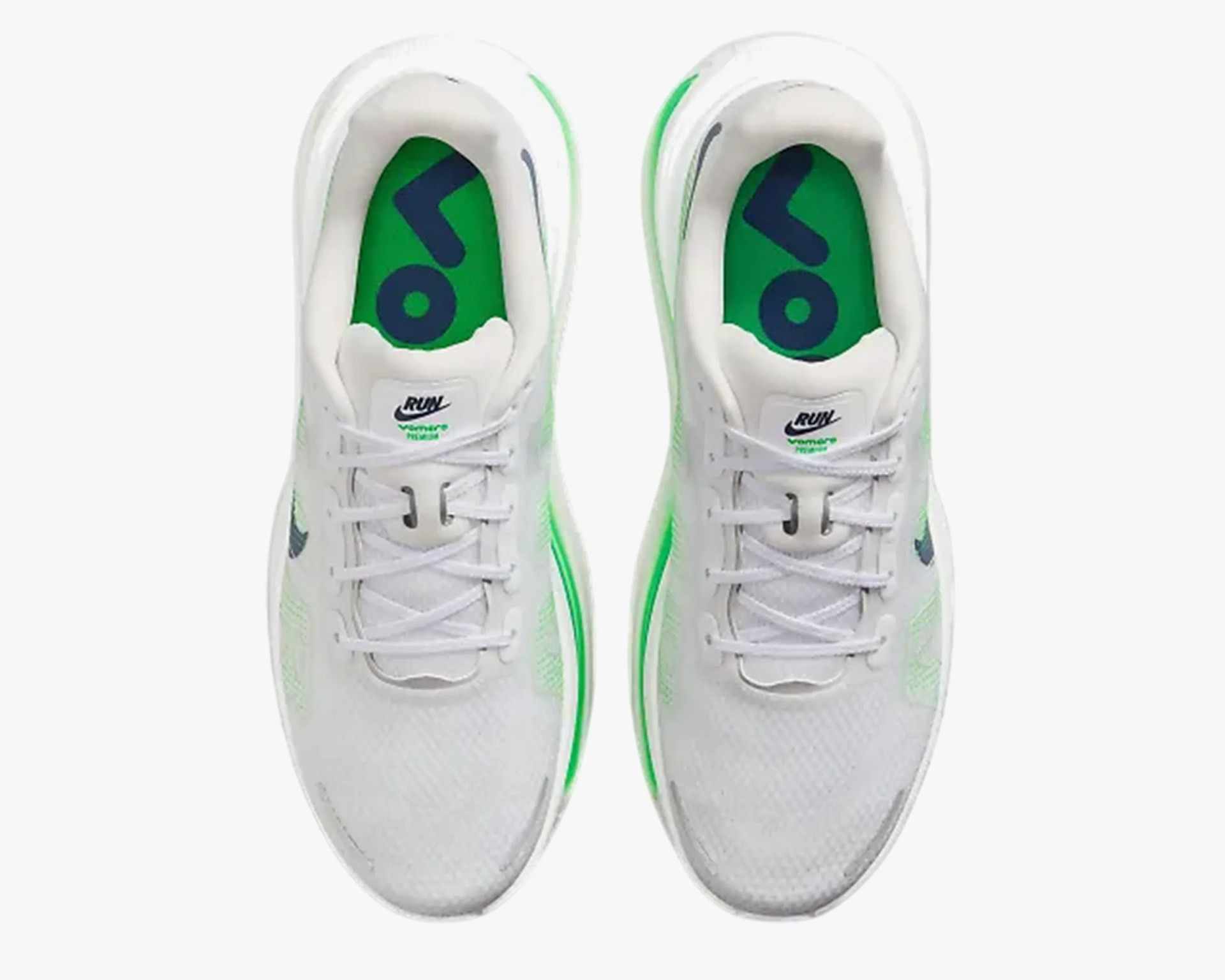 Pair of white Nike running shoes with green insoles and green accents on the sides.