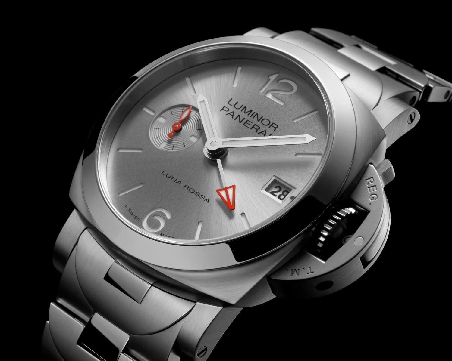 Silver Panerai Luminor Luna Rossa wristwatch with red accents and metal bracelet on black background.