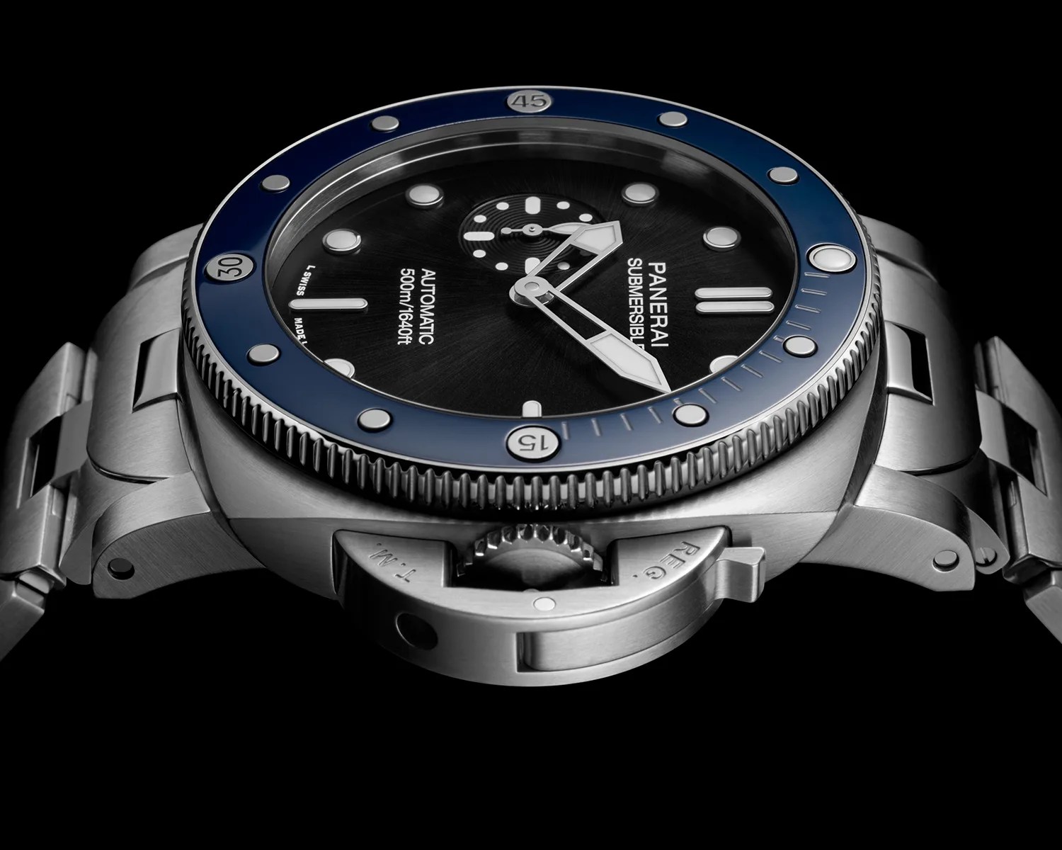 Stainless steel Panerai Submersible watch with black dial, blue bezel, and luminous hands and markers.