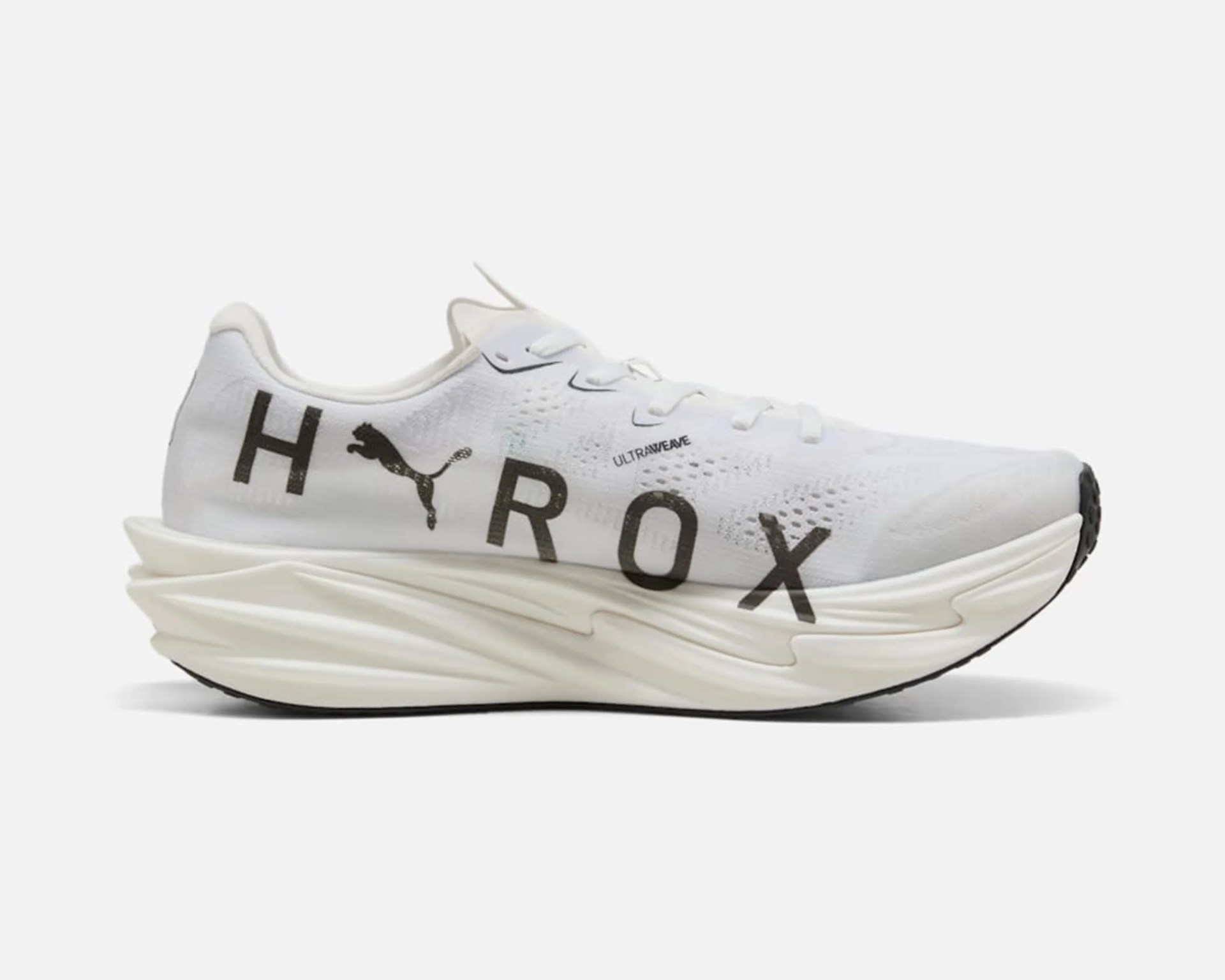 White Puma running shoe with black "HEROX" text and thick sculpted sole.