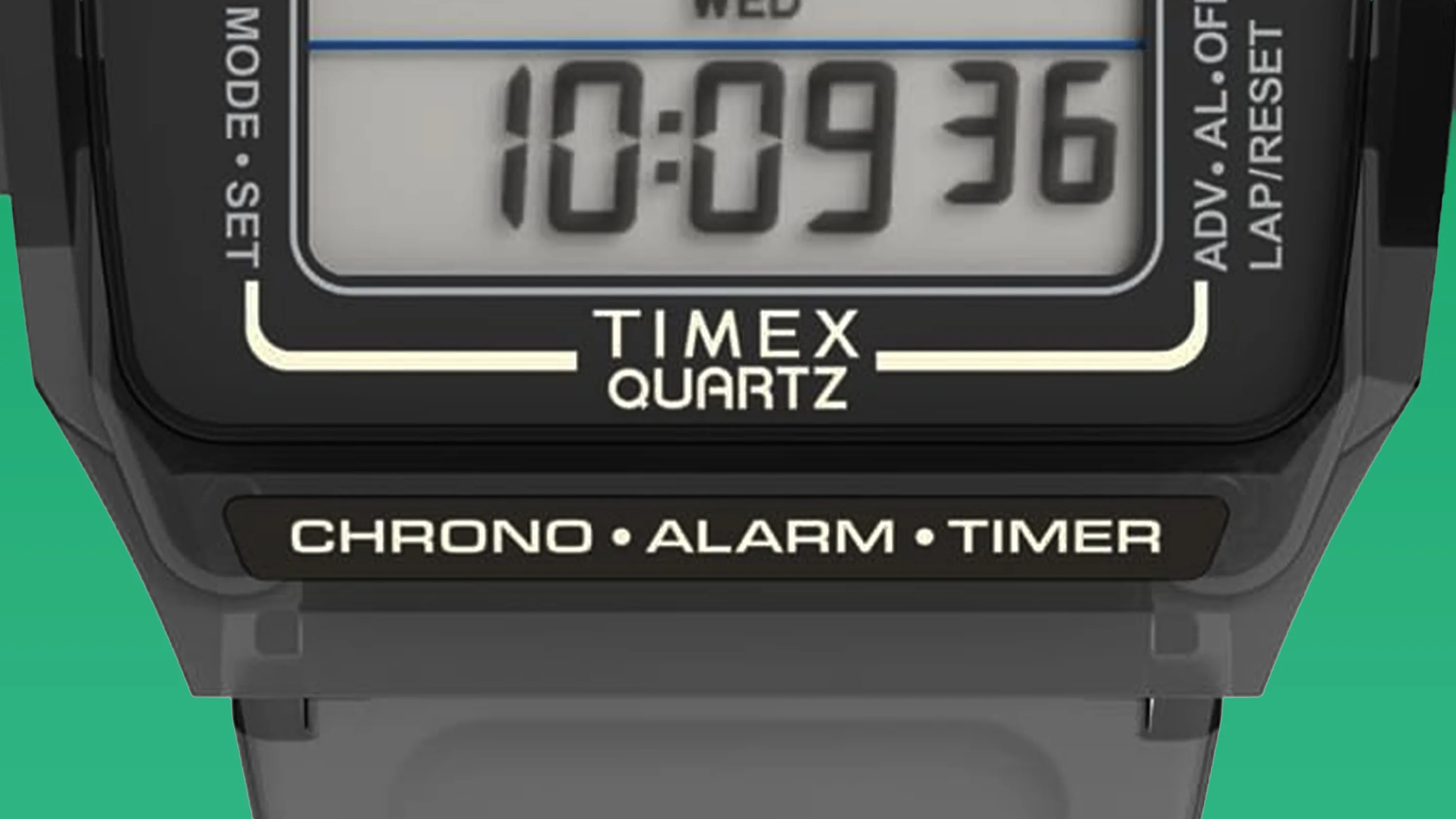 Close-up of a Timex Quartz digital watch face showing time 10:09:36 with chrono, alarm, and timer functions.
