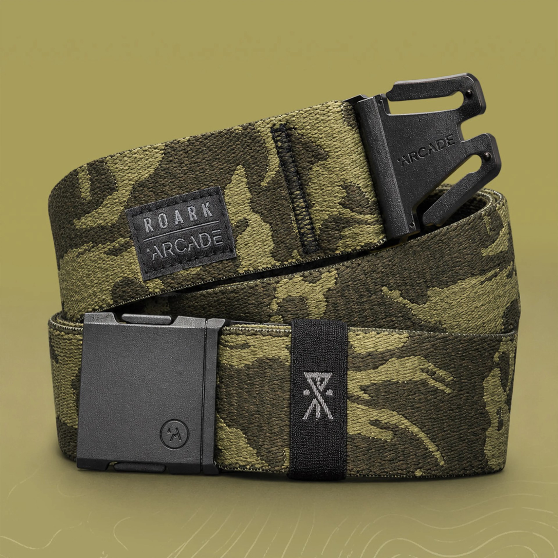 Green camouflage fabric belt with black plastic buckle and "ROARK ARCADE" label.