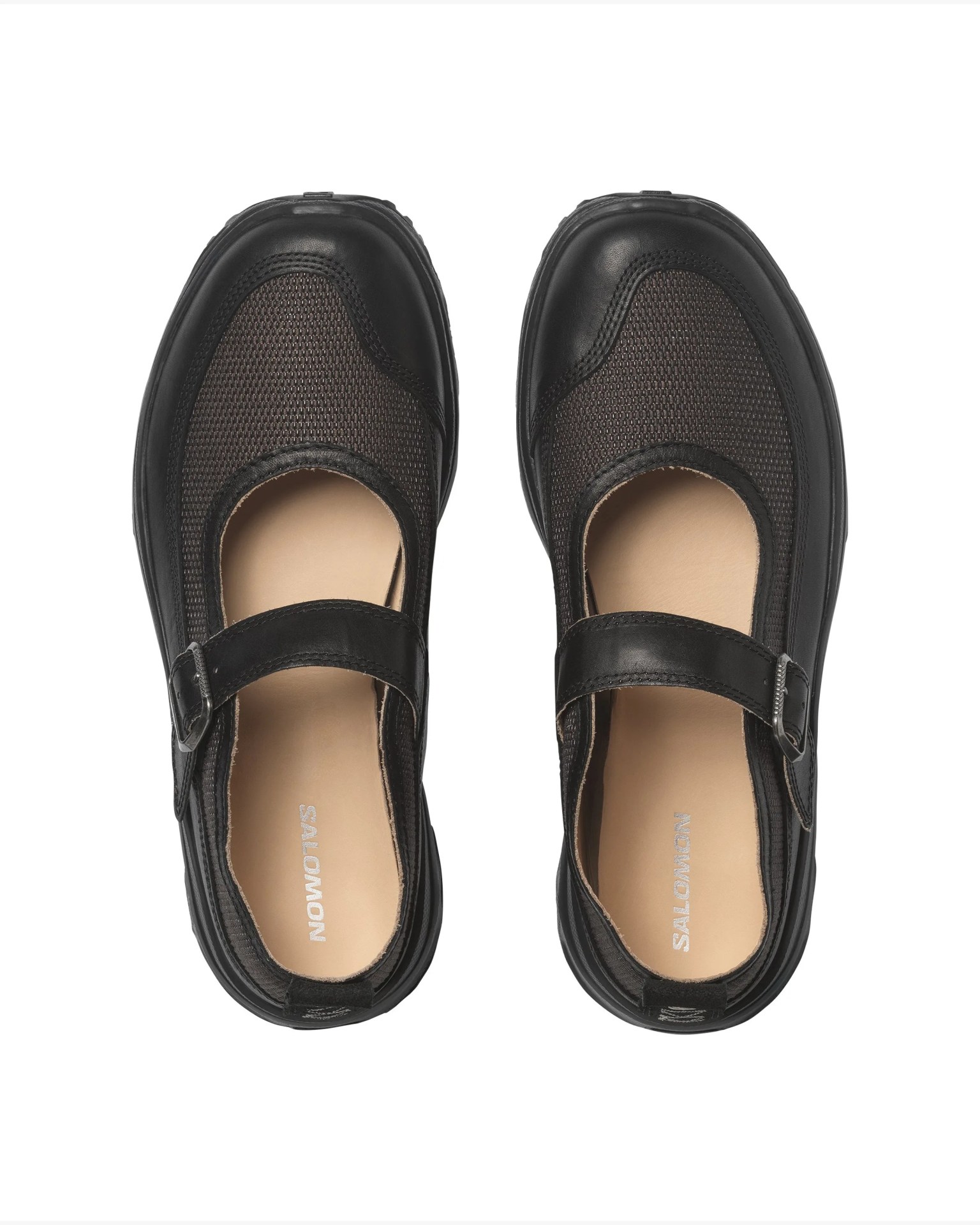 Pair of black Mary Jane shoes with mesh fabric and leather straps, viewed from above.