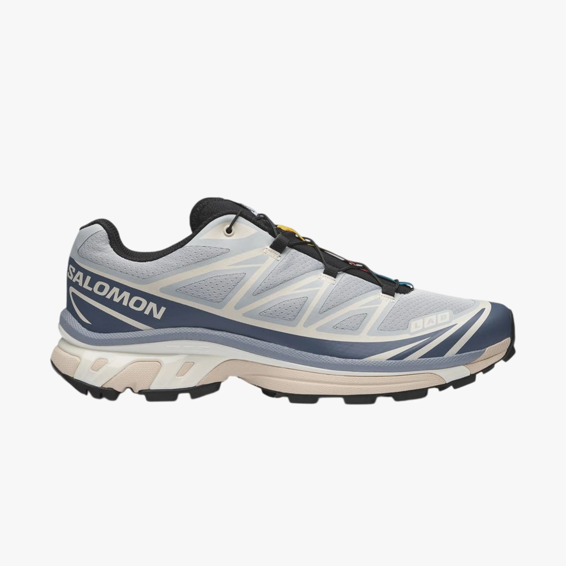Light gray and navy blue Salomon trail running shoe with black laces and beige sole.