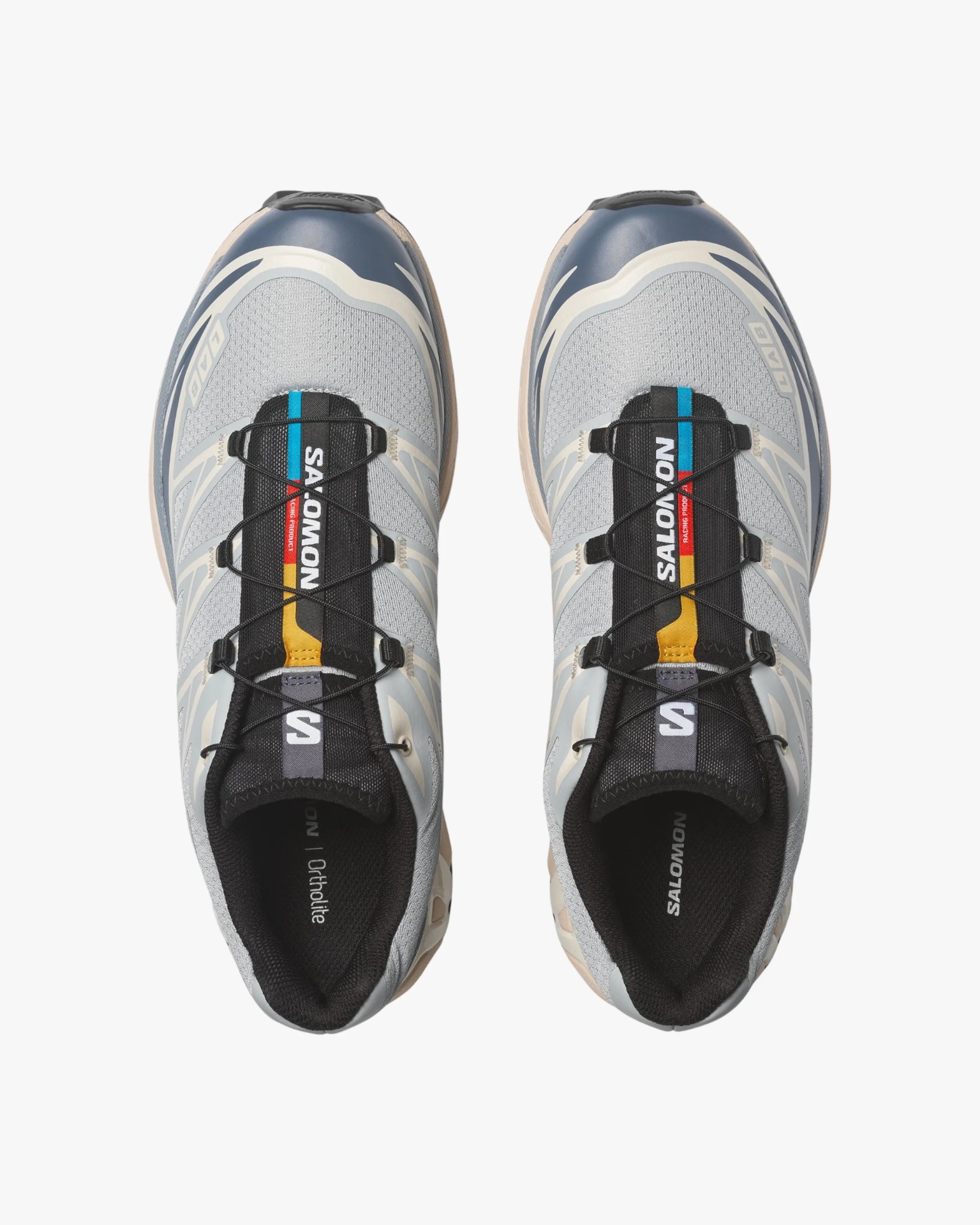 Pair of gray and navy Salomon running shoes with black and multicolor tongue labels viewed from above.