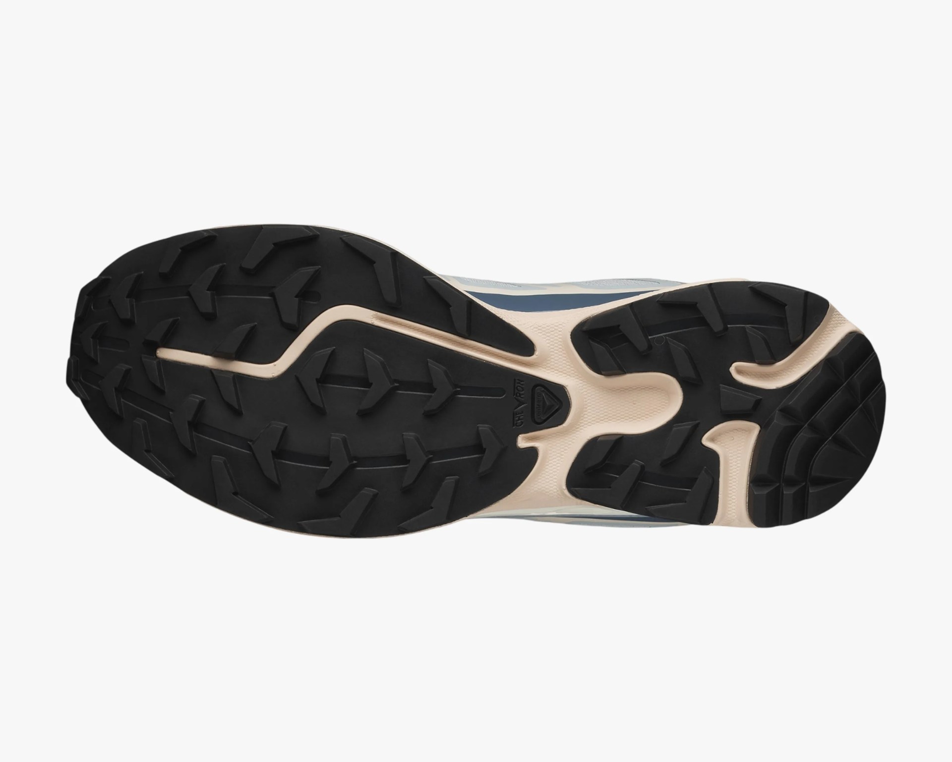 Black and beige rugged rubber outsole of a trail running shoe with deep treads.