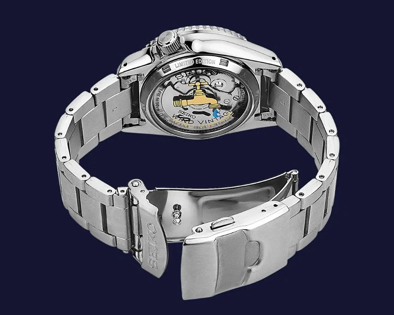 Silver stainless steel Seiko wristwatch with open clasp and visible mechanical movement through the back case.