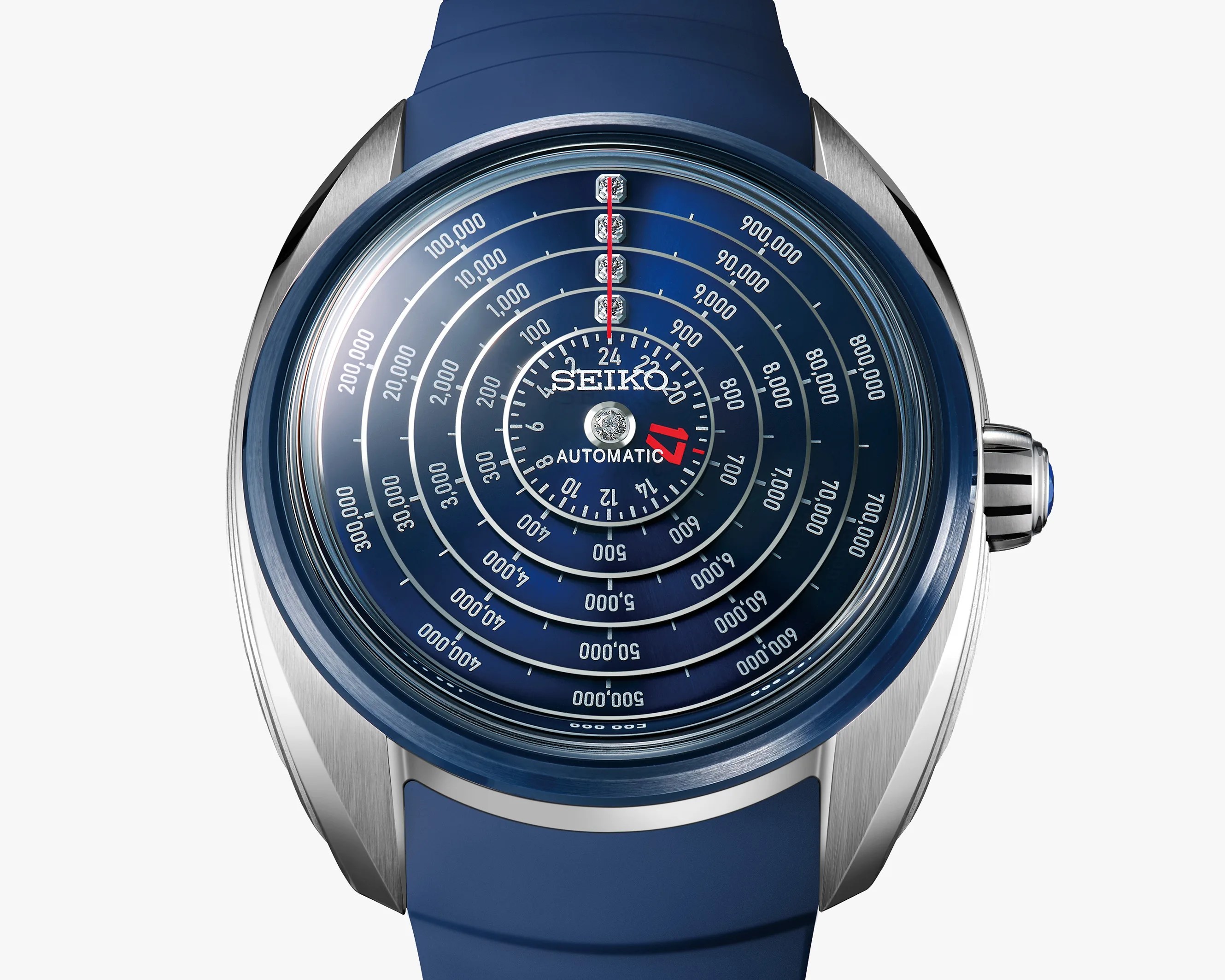 Blue Seiko automatic watch with concentric circular scales and a blue rubber strap.
